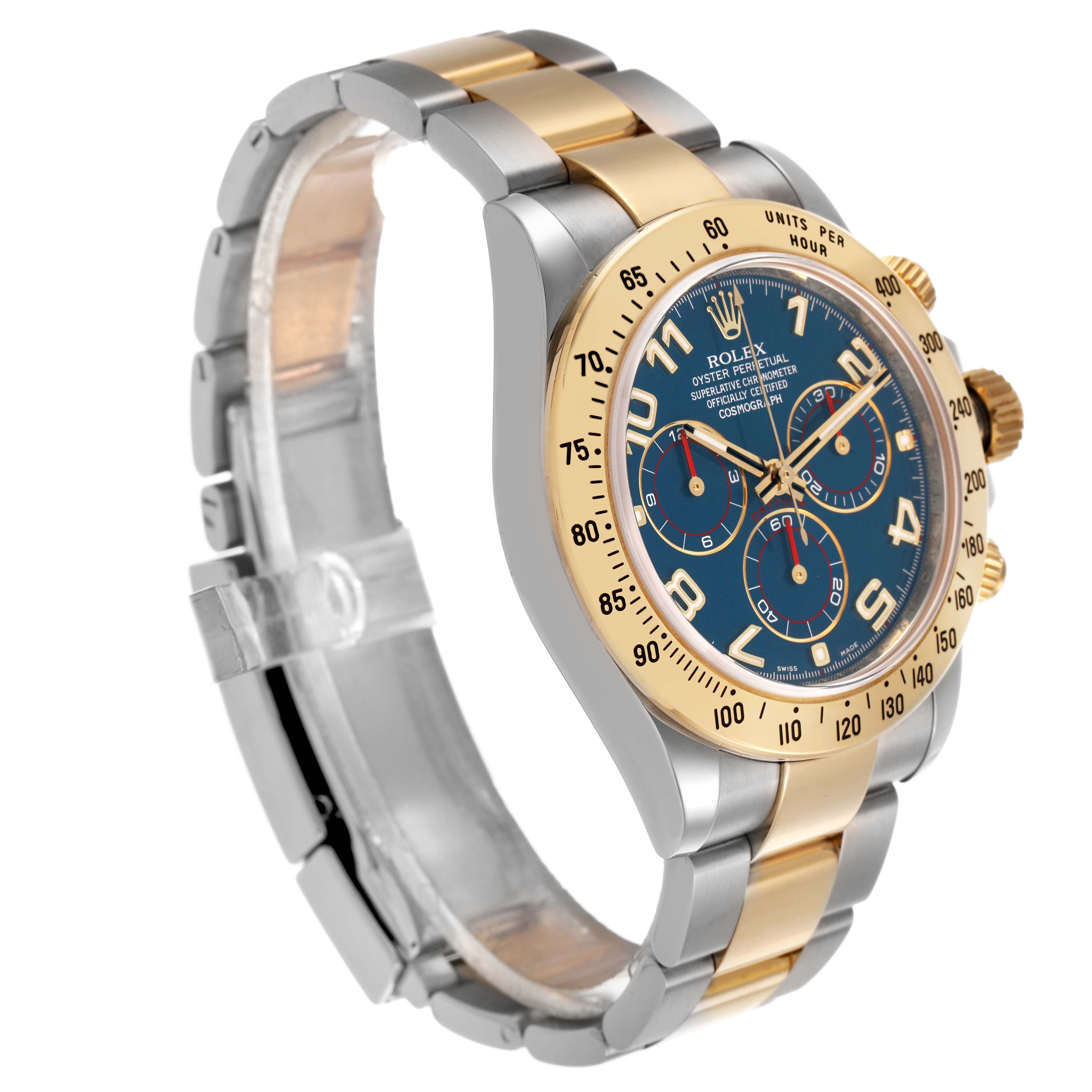The Rolex Daytona 116523 Men's Steel and Gold (two tone) Blue Dial watch is shown at a slight angle displaying the face, bezel, and part of the bracelet.