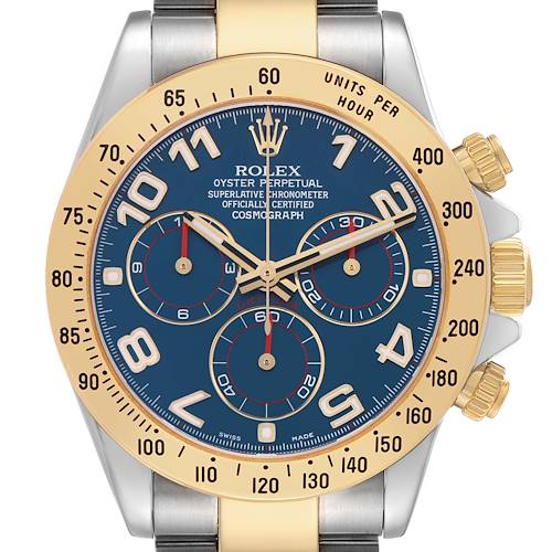 The Rolex Daytona 116523 Men's Steel and Gold (two tone) Blue Dial watch is shown from the front, highlighting its blue dial, gold bezel, and chronograph subdials.