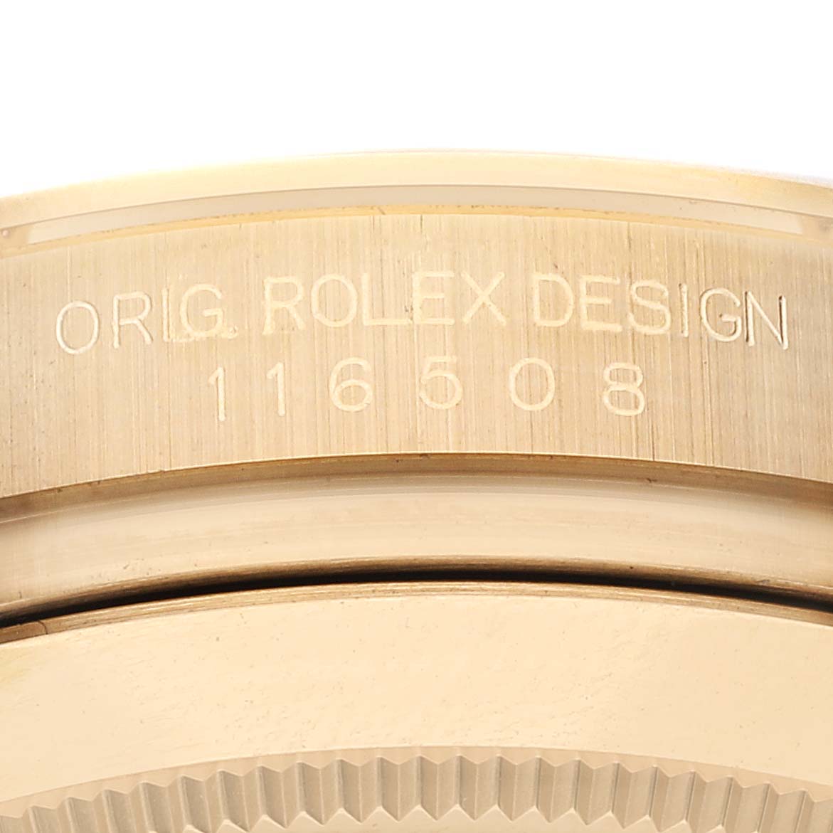 This image shows the engraved side of the casing for the Rolex Daytona 116508 Men's Yellow Gold Black Dial 116508 Men's Yellow Gold Black Dial model with design number 116508.