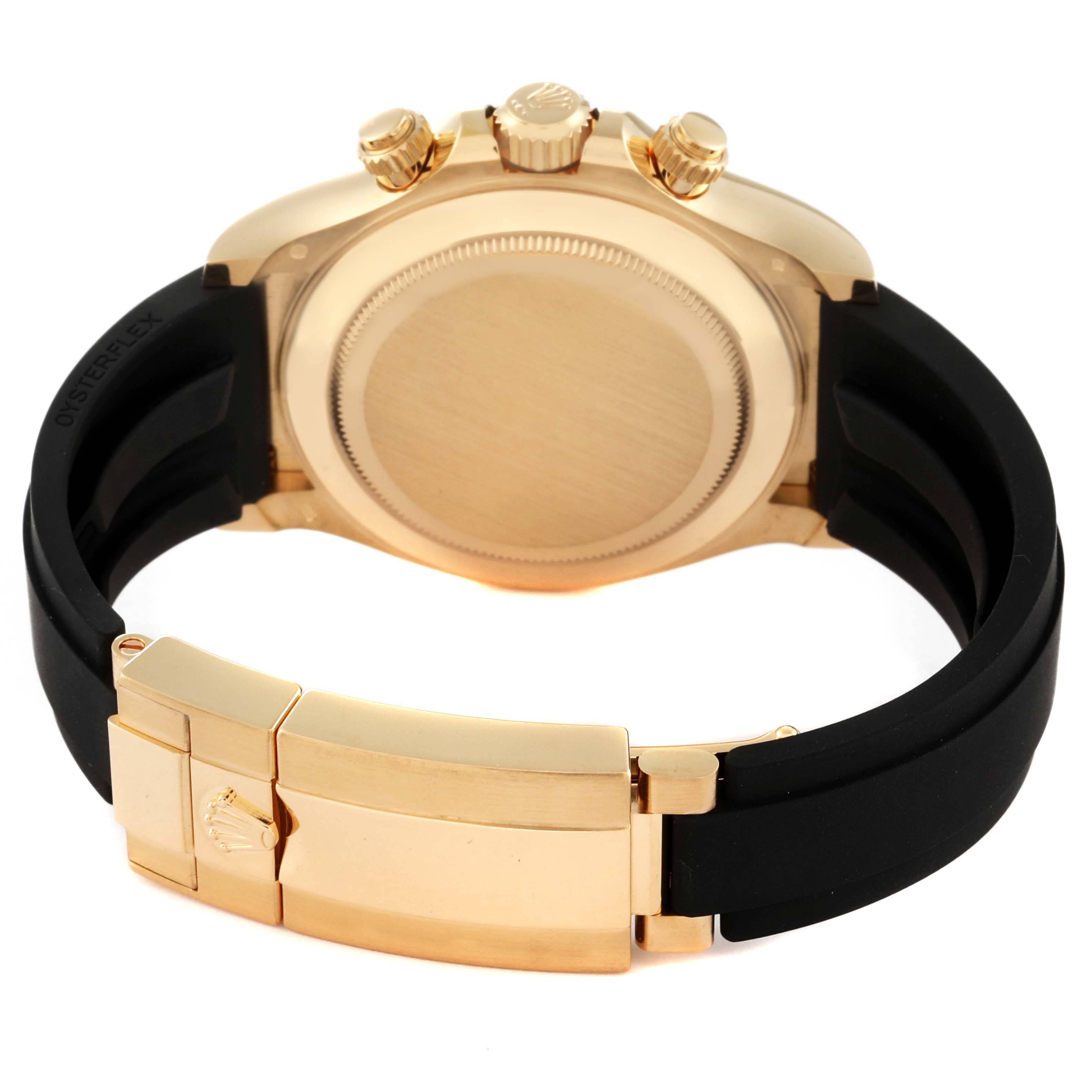 The image shows the back of a Rolex Daytona 116518 Men's Yellow Gold Champagne Dial 116518 Men's Yellow Gold Champagne Dial watch, highlighting its gold case, crown, pushers, and the black strap with a gold clasp.