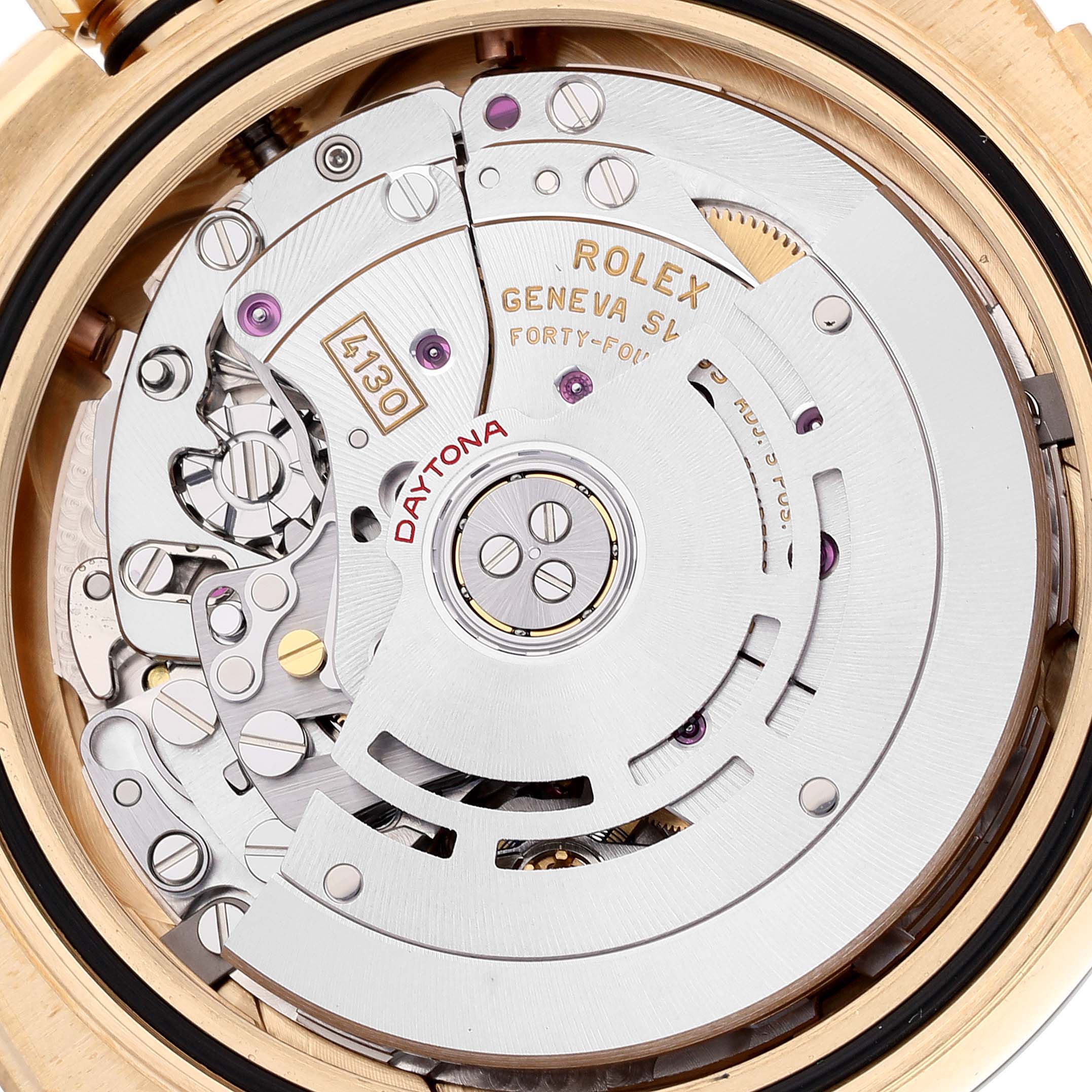 The image shows the Rolex Daytona 116518 Men's Yellow Gold Champagne Dial 116518 Men's Yellow Gold Champagne Dial watch's movement mechanism, including details like the rotor, gears, and inscriptions.