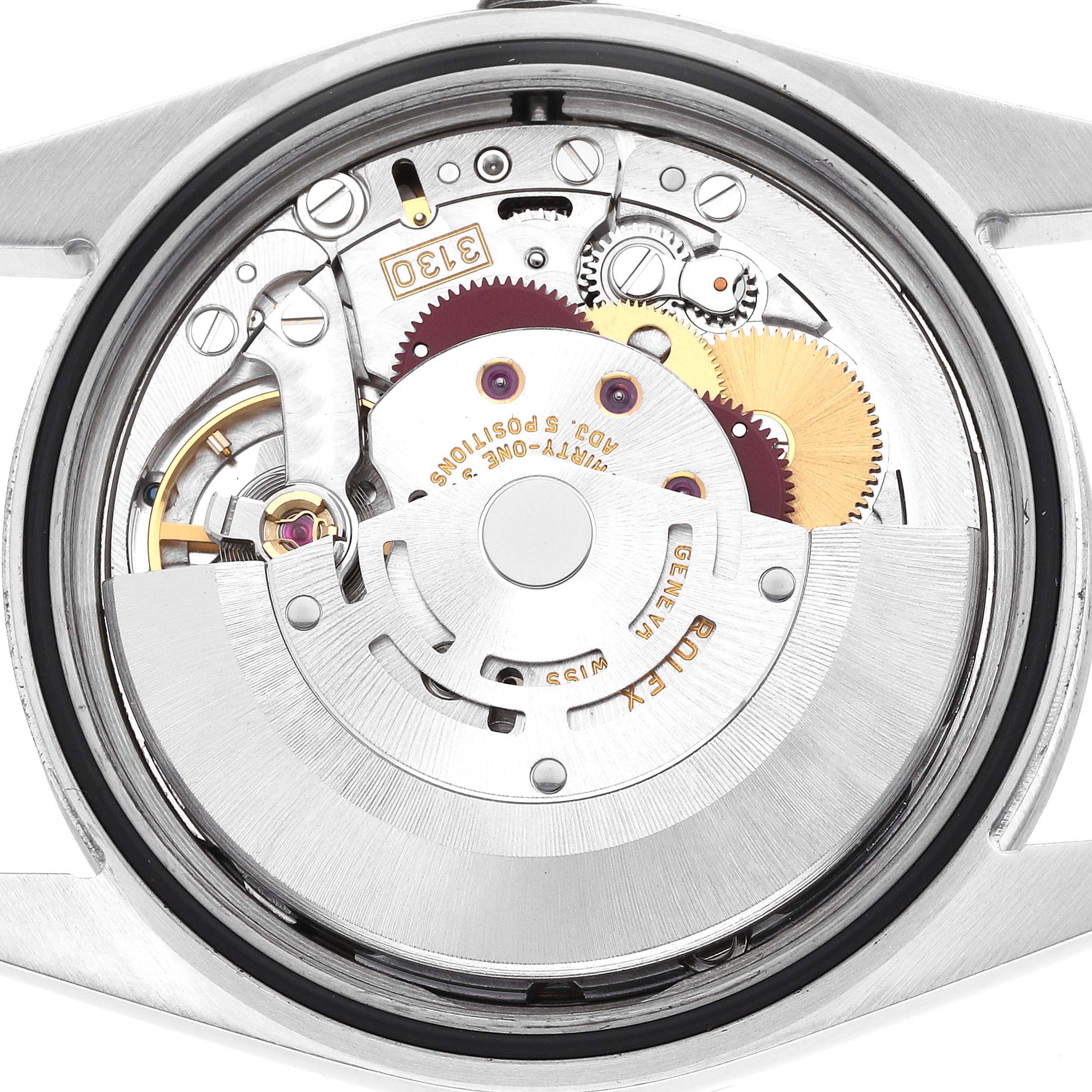 The image shows the movement of a Rolex Explorer model 114270, viewed from the back, highlighting gears, rotors, and other mechanical components.