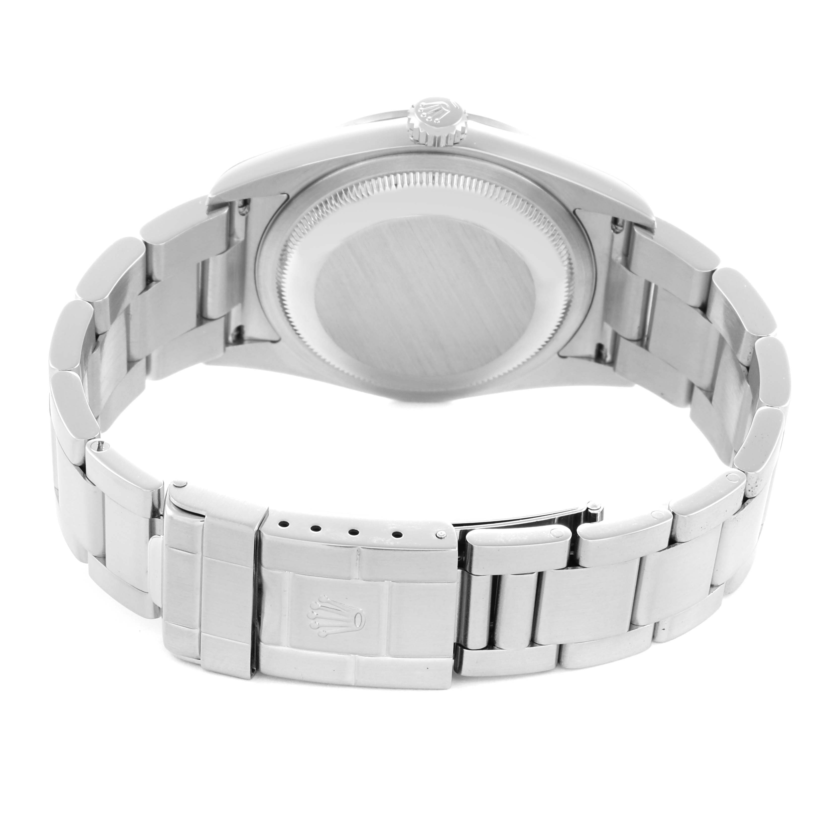 The image shows the back view of a Rolex Explorer model 114270 men's watch, highlighting the case back, crown, and bracelet clasp with the Rolex logo.