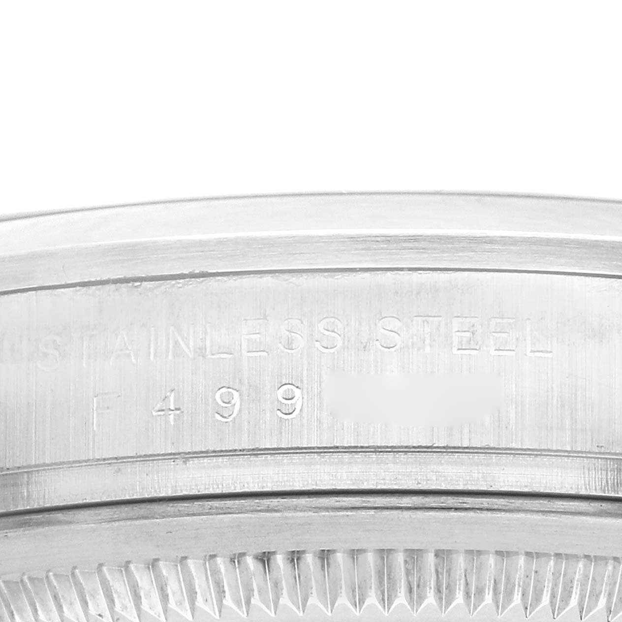 The image shows a close-up of the side of the Rolex Explorer, model 114270, highlighting the engraved markings on the stainless steel case.