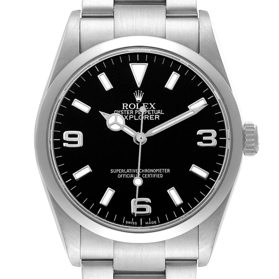 The Rolex Explorer model 114270 is shown from a front angle, displaying its black dial, hour markers, hands, and part of the bracelet.