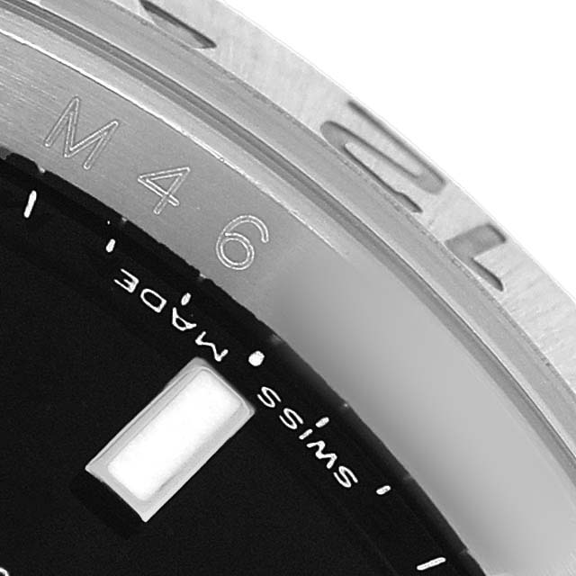 The image shows a close-up of the bezel and partial dial of a Rolex Explorer 16570 Men's Stainless Steel Black Dial, with "SWISS MADE" visible.