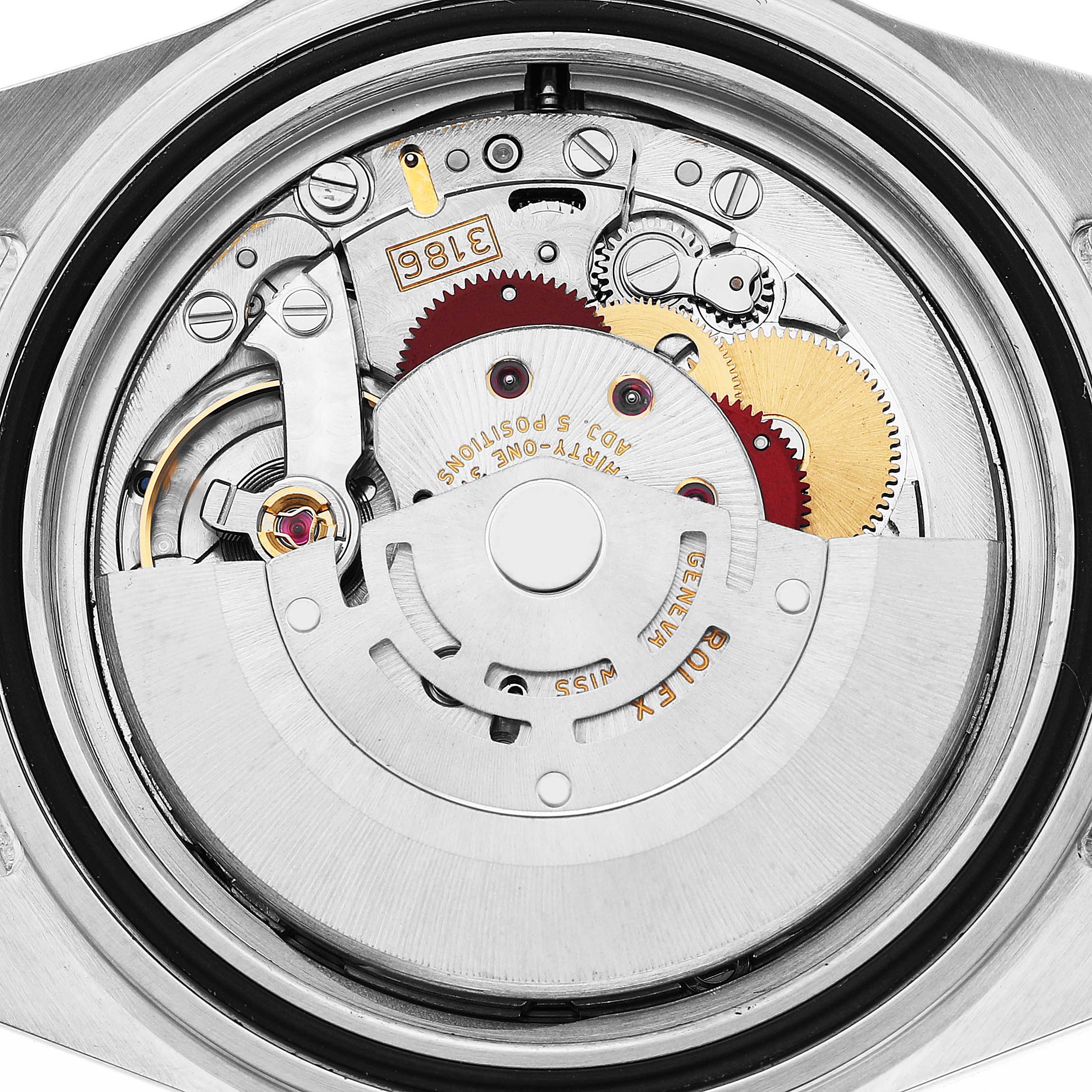 The image shows the intricate movement of a Rolex Explorer 16570 Men's Stainless Steel Black Dial watch from a rear angle, displaying gears and the rotor mechanism.