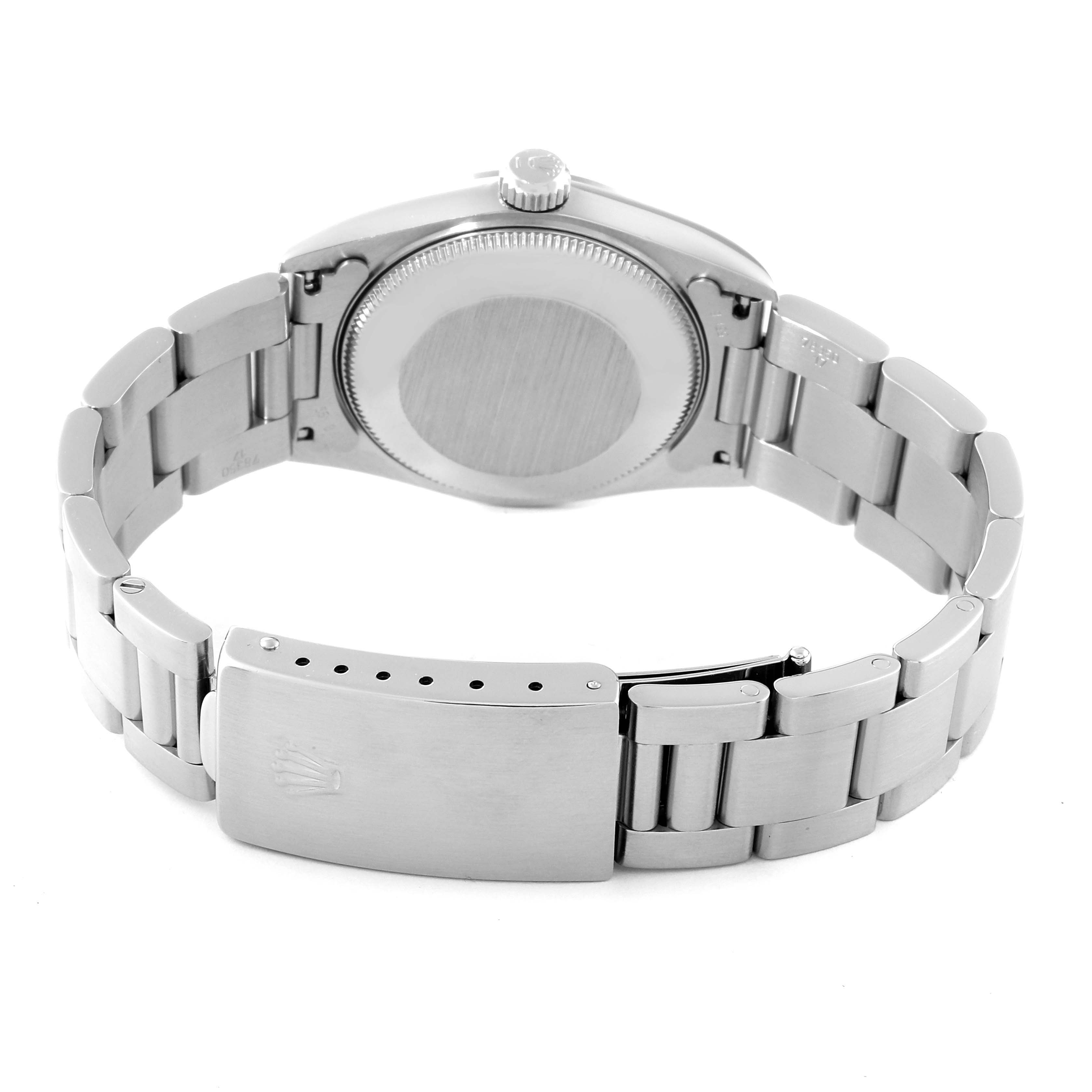 This image shows the back and bracelet clasp of a Mid-Size Rolex watch, specifically focusing on the case back and the deployment clasp.