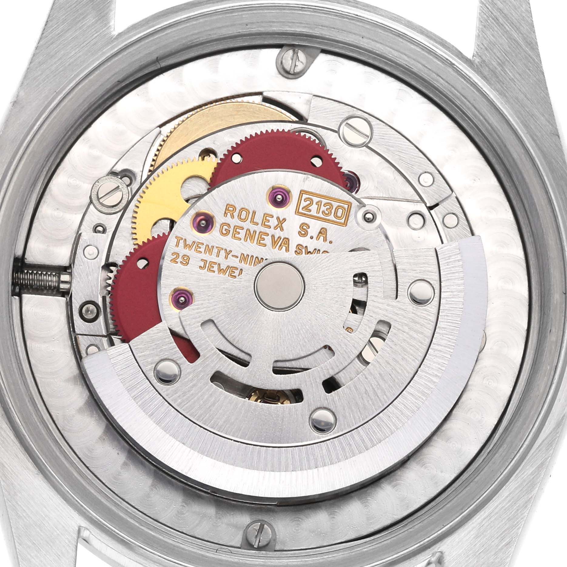 This is an internal view of the Rolex Mid-Size 67480 Women's Stainless Steel Blue Dial 67480 Women's Stainless Steel Blue Dial model, showing the movement mechanism and jewel bearings.