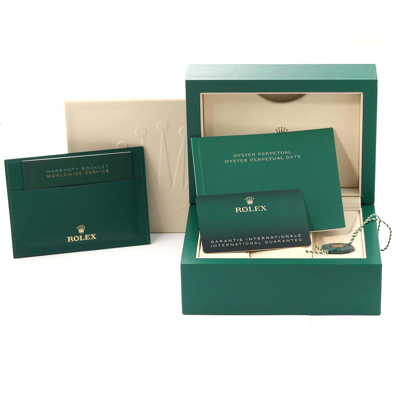 The image shows a green Rolex Oyster Perpetual 124300 Men's Stainless Steel Green Dial 124300 Men's Stainless Steel Green Dial watch box, international guarantee card, warranty booklet, and booklets.