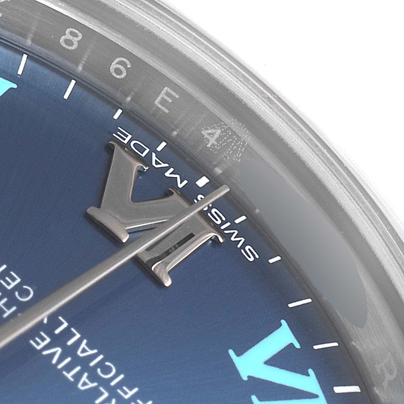 This close-up image shows the dial and minute markers of a Mid-Size Rolex watch, focusing on the Roman numeral VI.