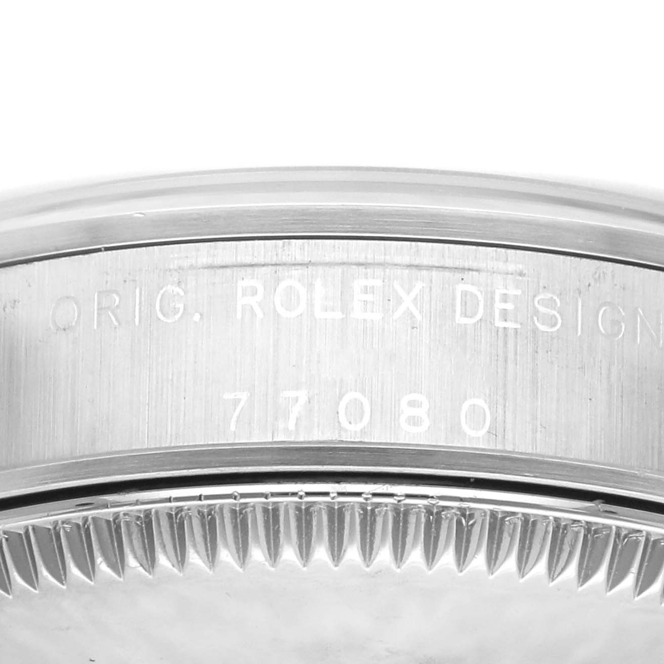The image shows a close-up of a Rolex Mid-Size 77080 Women's Stainless Steel Pink Dial 77080 Women's Stainless Steel Pink Dial model's case back, displaying the engraving "ORIG. ROLEX DESIGN" and the model number "77080."