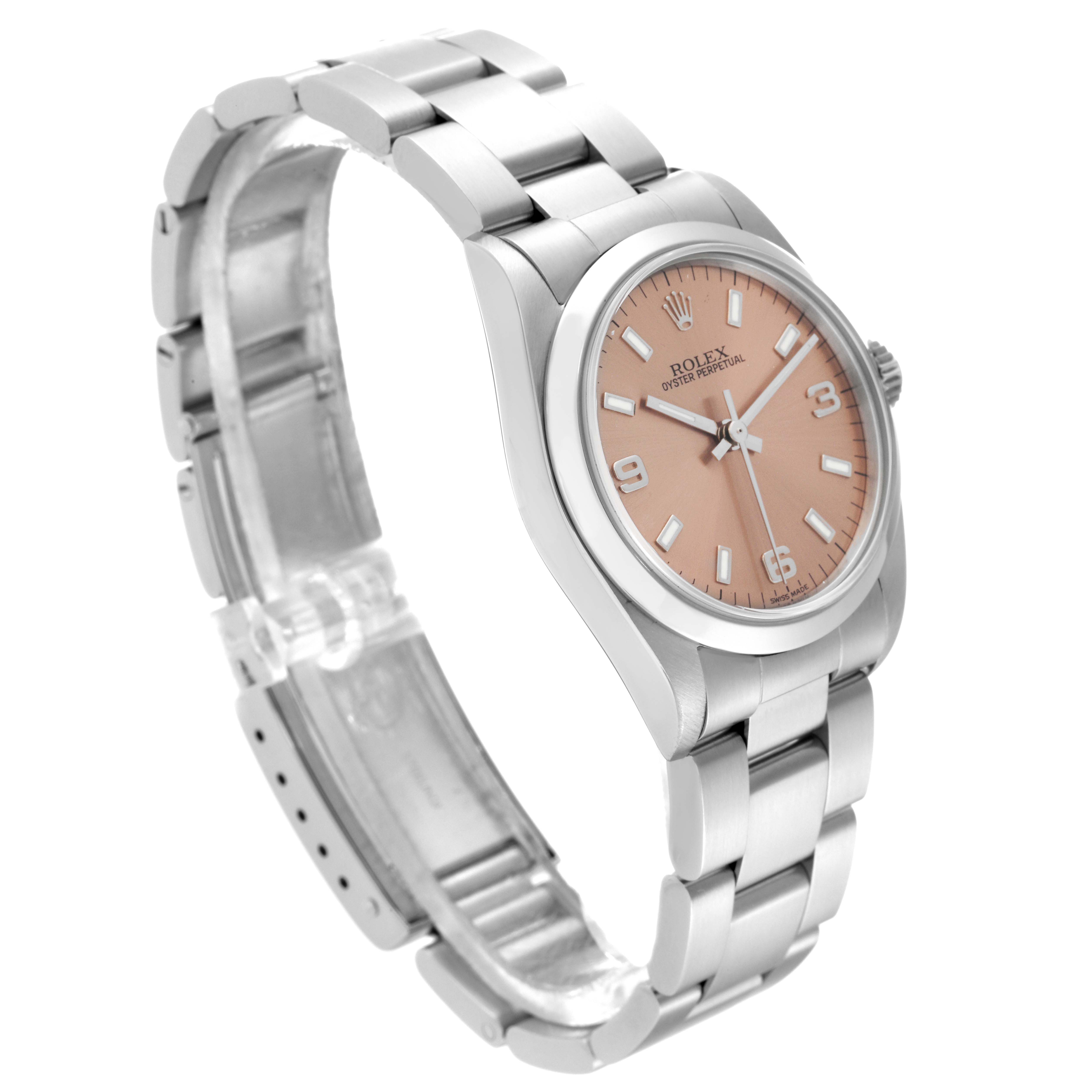 The image shows a side angle of a Rolex Mid-Size 77080 Women's Stainless Steel Pink Dial 77080 Women's Stainless Steel Pink Dial watch, highlighting the bracelet, case, and salmon-pink dial.