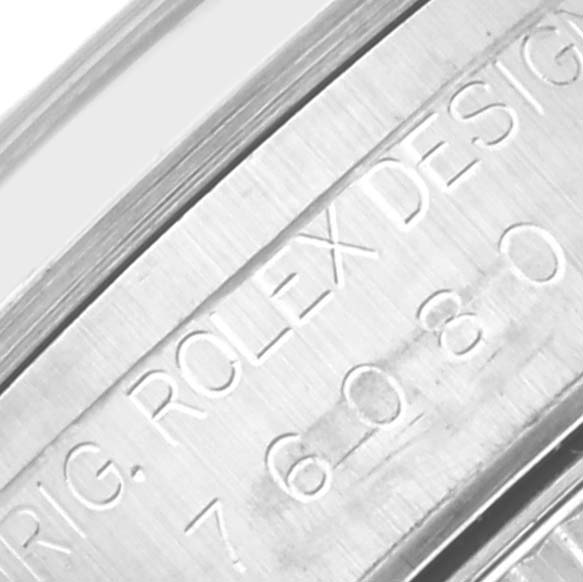 This close-up image shows the engraved text on the case of an Oyster Perpetual model by Rolex.