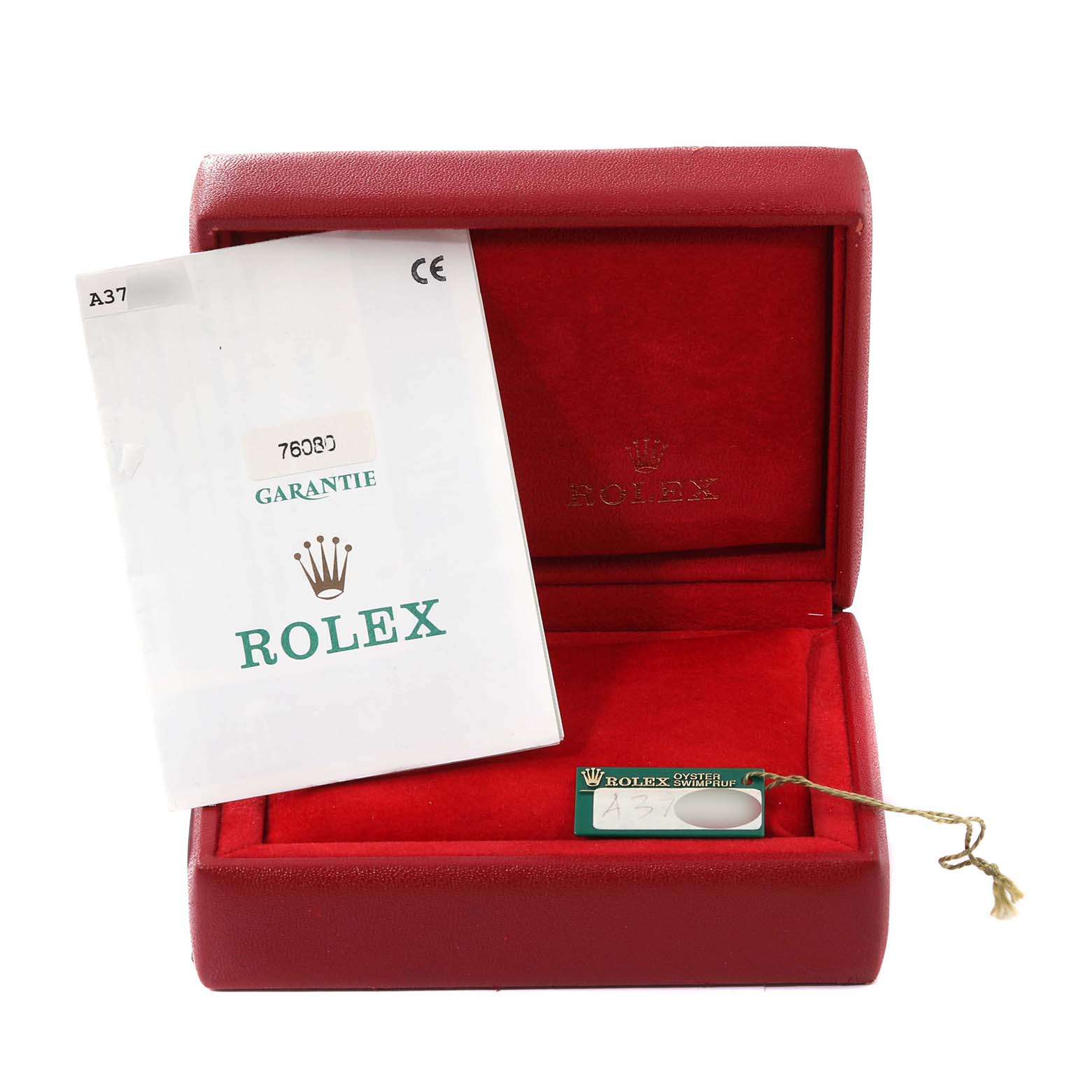 The image shows a red Rolex box for the Oyster Perpetual model, along with its warranty card and tag.