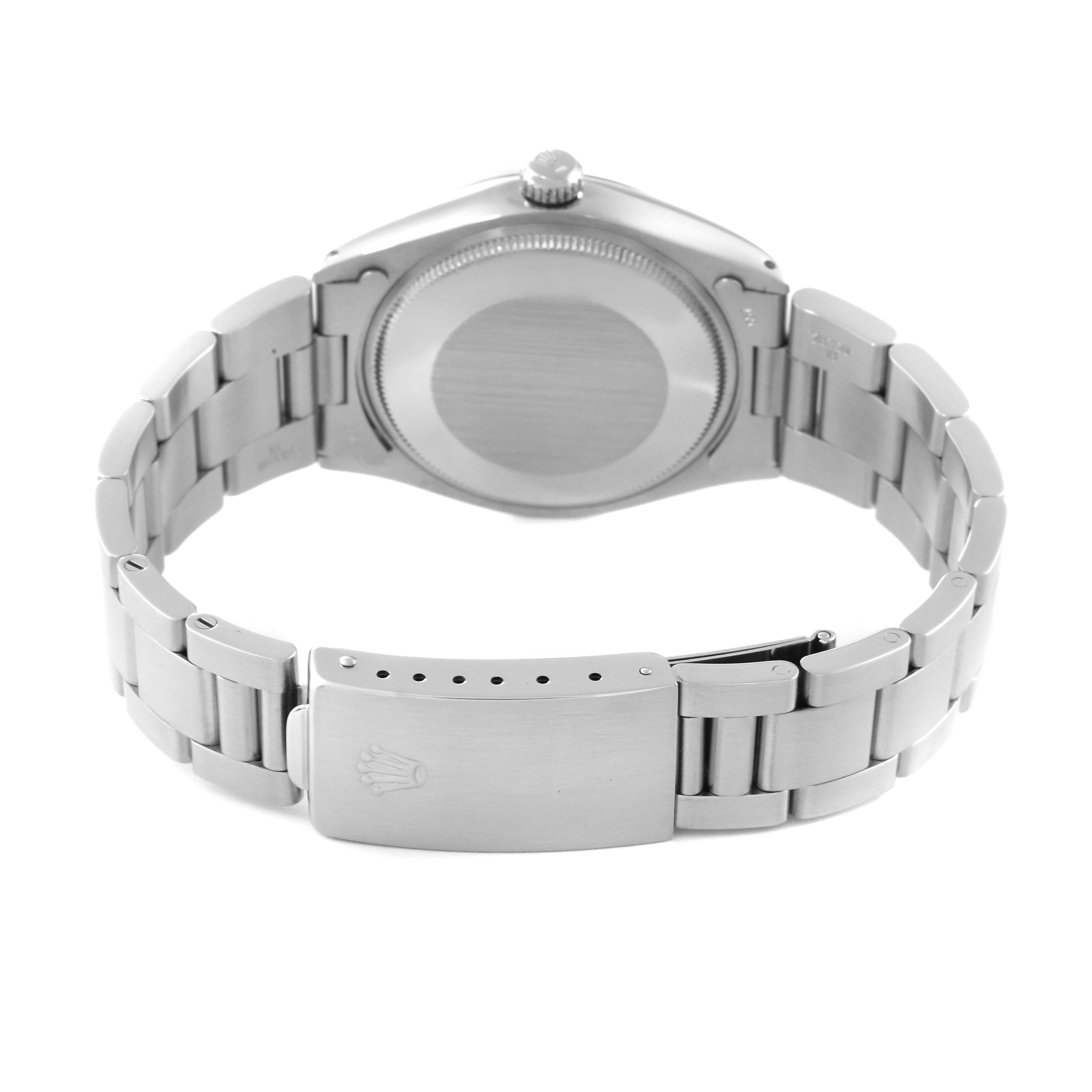 The image shows the backside of the Vintage Collection Rolex watch, highlighting the clasp and bracelet links.