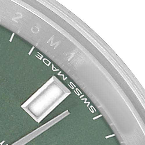 The image shows a close-up of the dial and bezel of a Rolex Oyster Perpetual 176200 Women's Stainless Steel Green Dial watch, focusing on the indices and "Swiss Made."