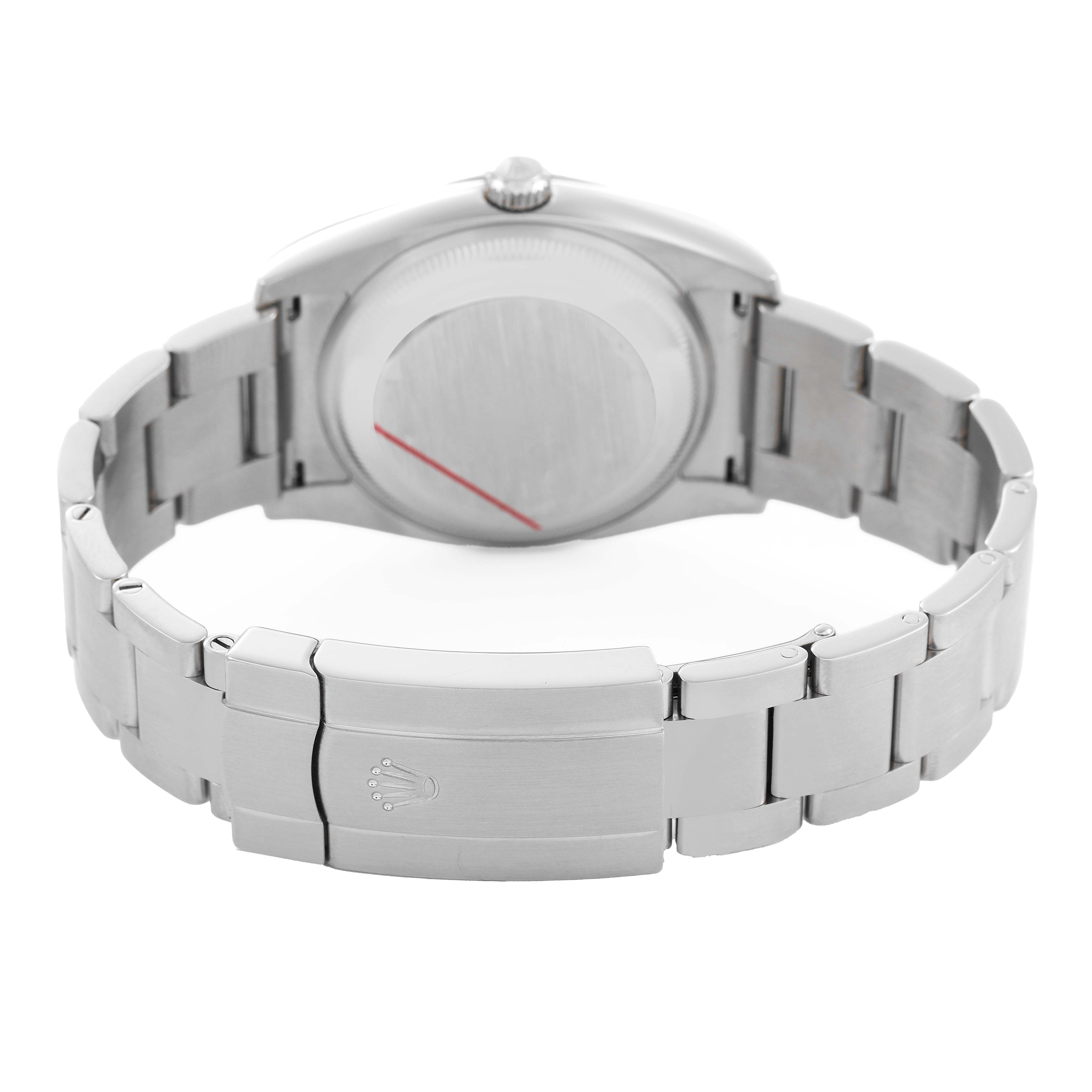 The image shows the back view of a Rolex Oyster Perpetual 114200 Men's Stainless Steel Green Dial watch, highlighting the clasp and bracelet.