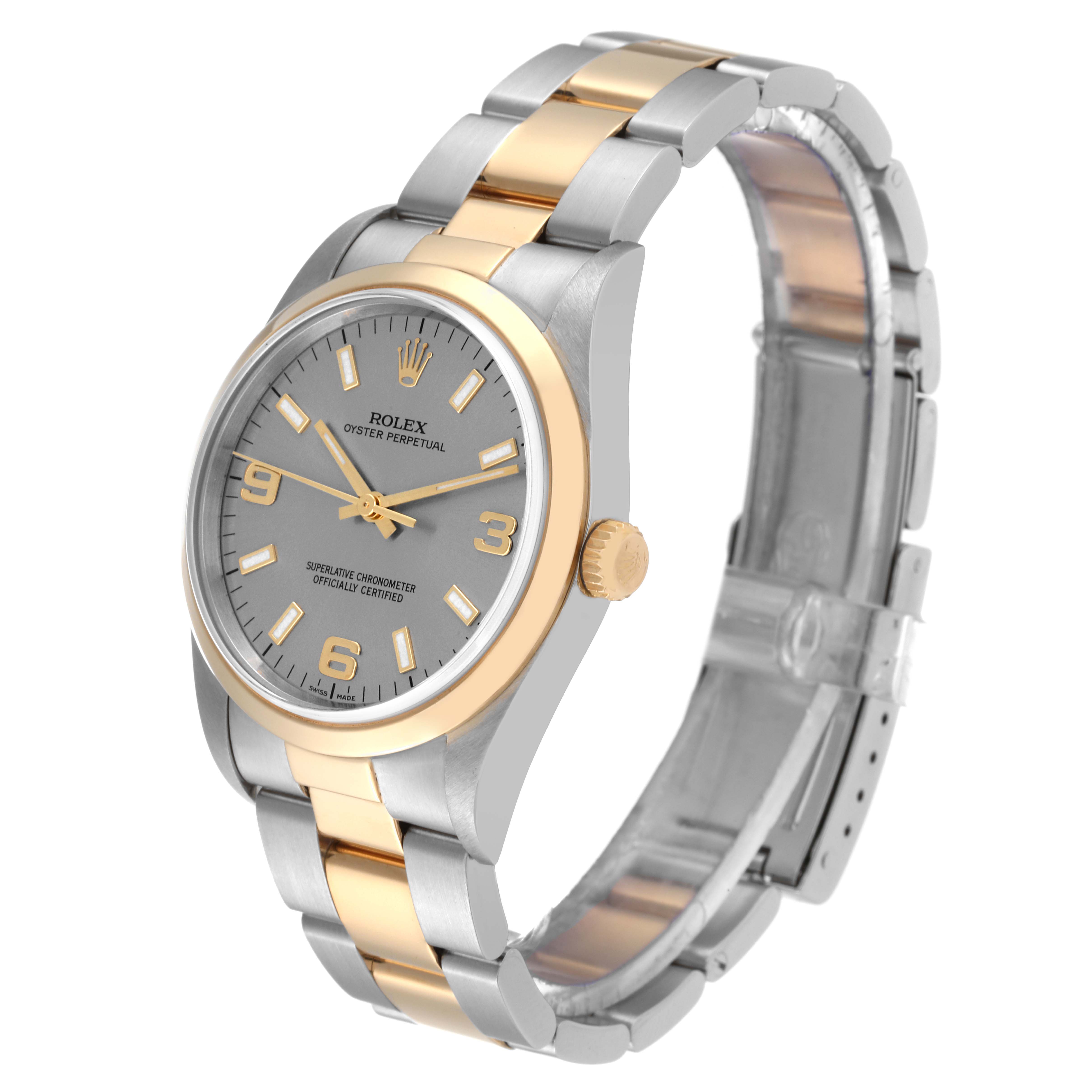 The image shows a Rolex Oyster Perpetual 14203 Men's Steel and Gold (two tone) Grey Dial 14203 Men's Steel and Gold (two tone) Grey Dial watch from a front-side angle, highlighting its two-tone bracelet, dial, and case.