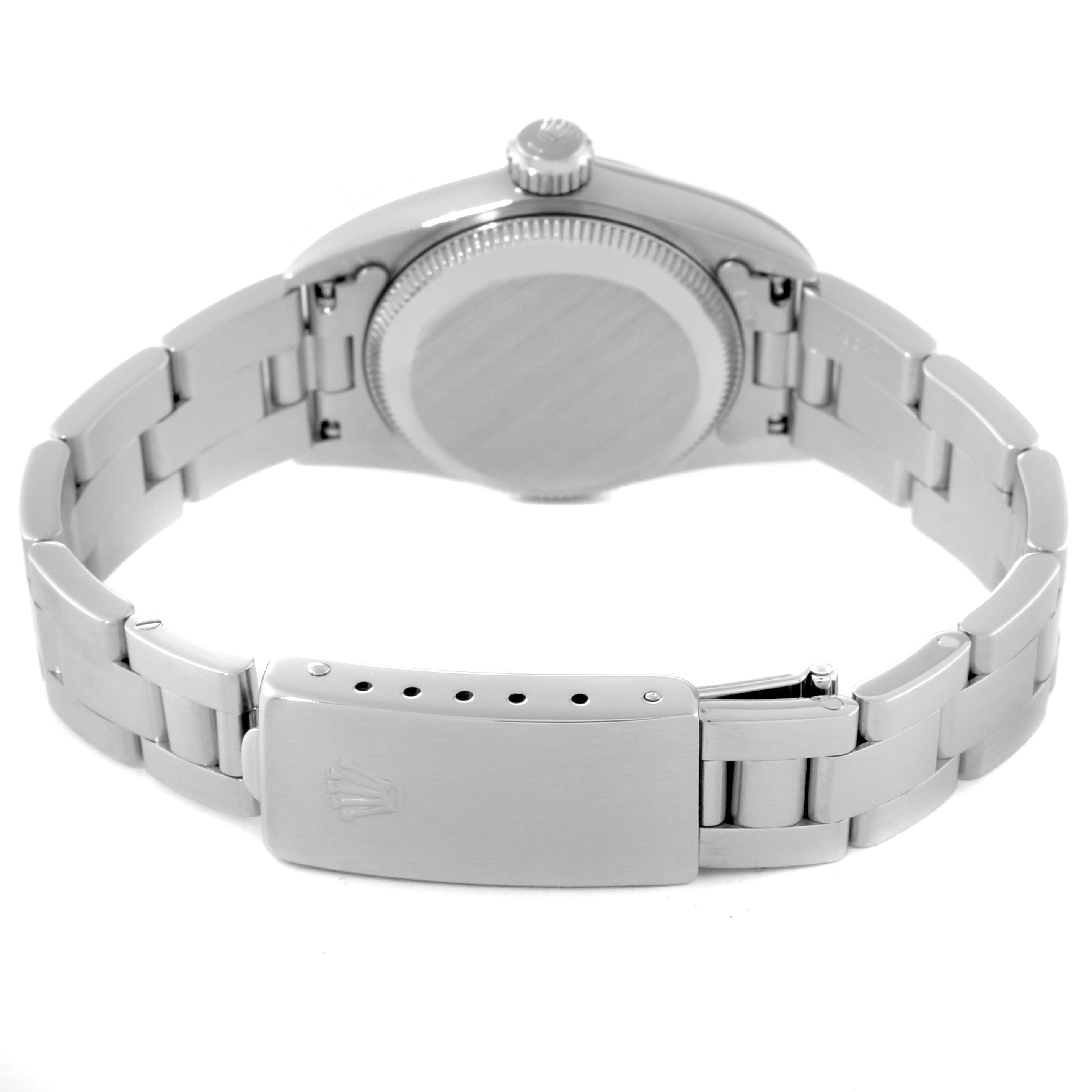 This image shows the back view of a Rolex Oyster Perpetual 67230 Women's Stainless Steel White Dial 67230 Women's Stainless Steel White Dial watch and its bracelet, focusing on the clasp and case back.