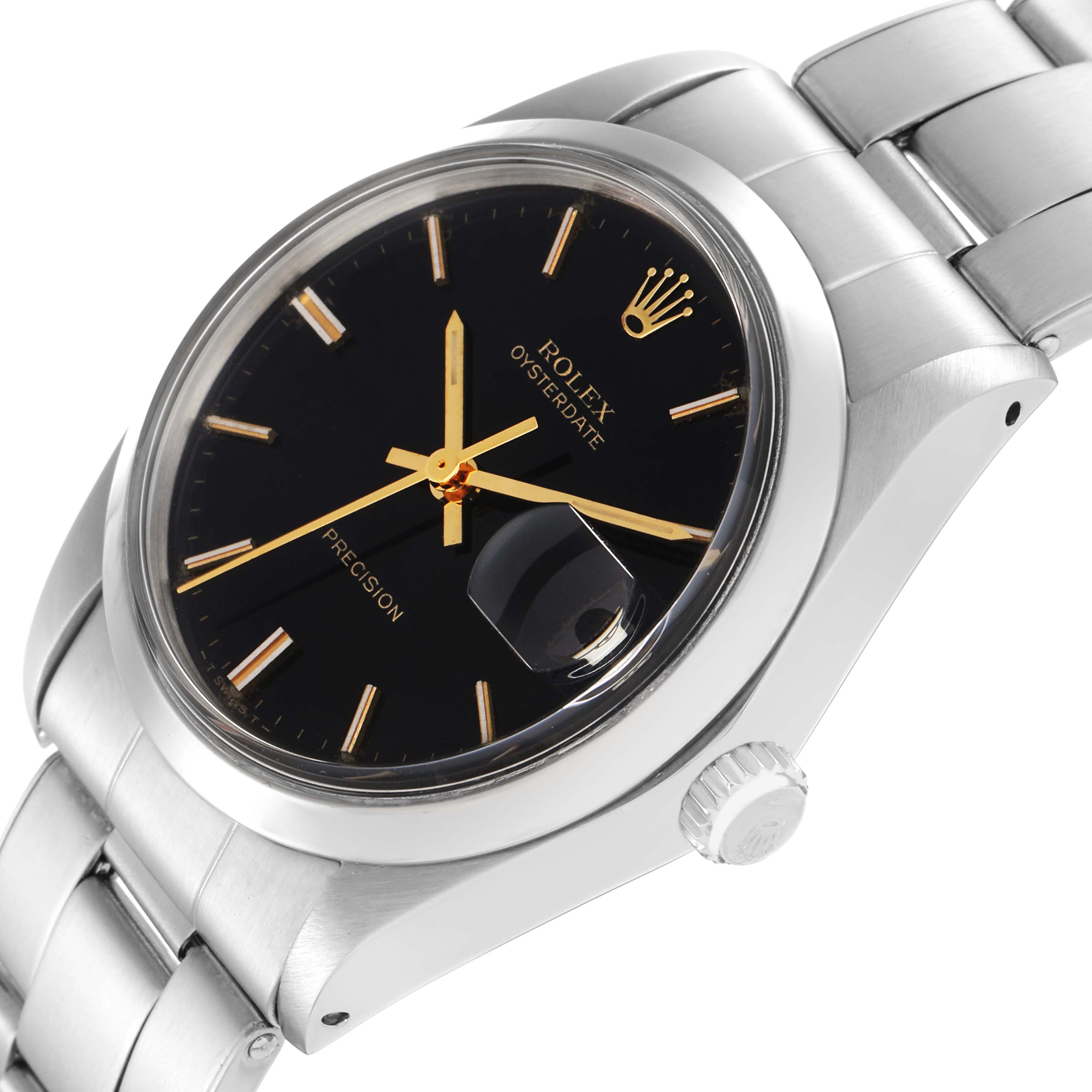 The image shows a Rolex Date model 6694 men's watch at an angled view, highlighting the dial, crown, magnified date window, and stainless steel band.