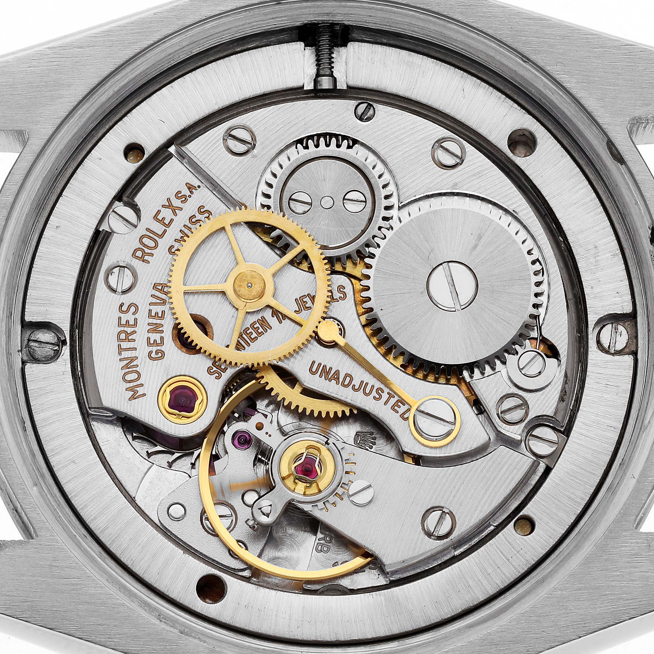 This image shows the intricate internal mechanics of a Rolex Vintage Collection 6694 Men's Stainless Steel Champagne Dial 6694 Men's Stainless Steel Champagne Dial watch from a rear angle, highlighting gears and cogs.