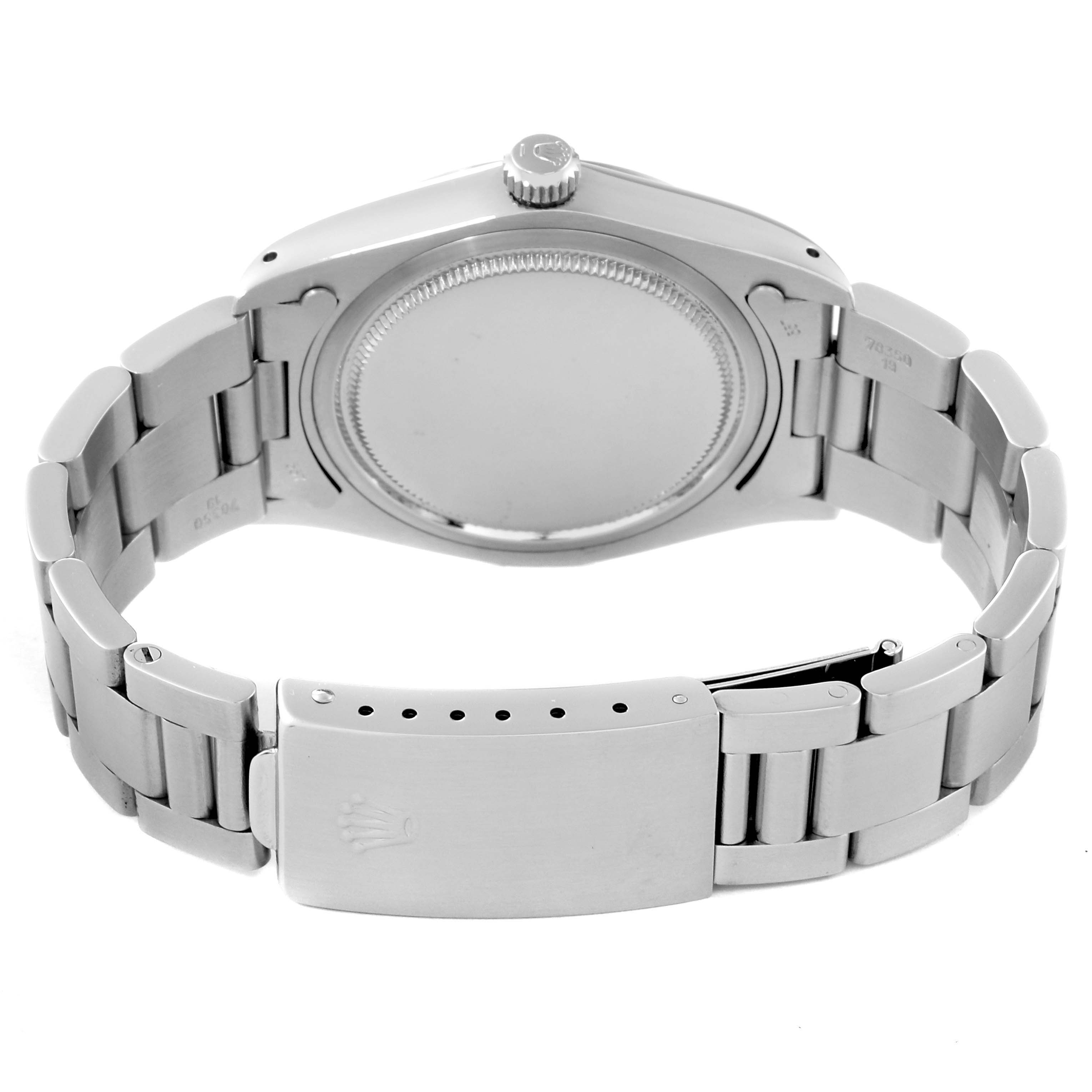 The image shows the back view of a Rolex Vintage Collection 6694 Men's Stainless Steel Champagne Dial 6694 Men's Stainless Steel Champagne Dial watch, highlighting the closed clasp and bracelet.