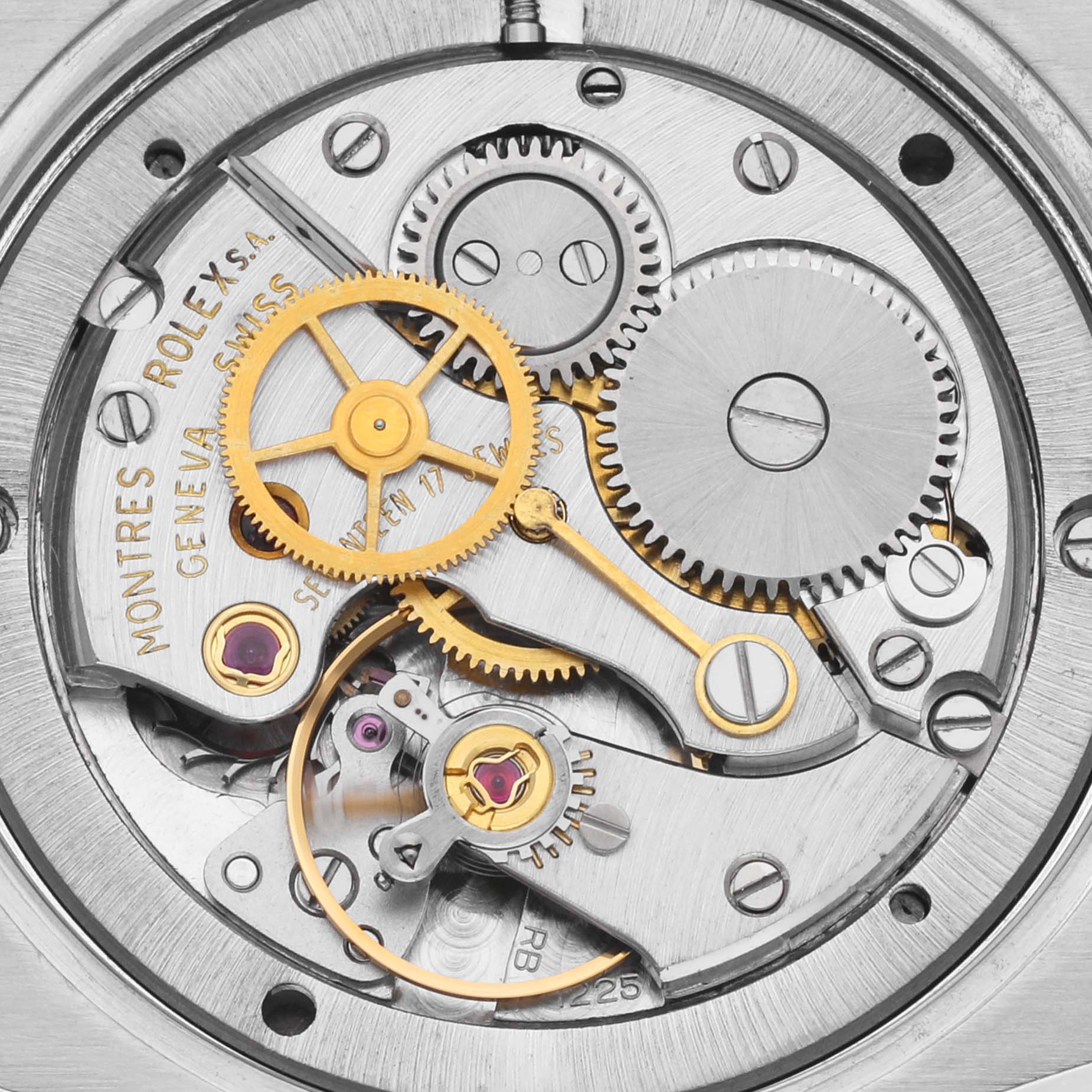 The image shows the intricate internal mechanism of the Rolex Vintage Collection 6694 Men's Stainless Steel Silver Dial 6694 Men's Stainless Steel Silver Dial watch, highlighting gears and the movement.