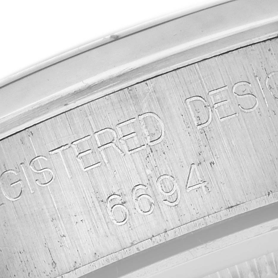 This close-up image shows the model number engraved on the inner bezel of the Vintage Collection Rolex watch.