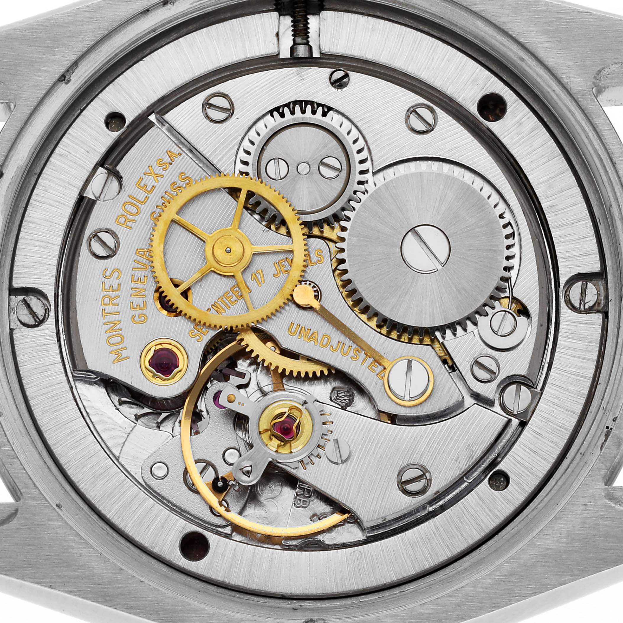 This is an image of the inner mechanism of a Rolex Vintage Collection 6694 Men's Stainless Steel Silver Dial 6694 Men's Stainless Steel Silver Dial watch showing gears and components from a rear angle.