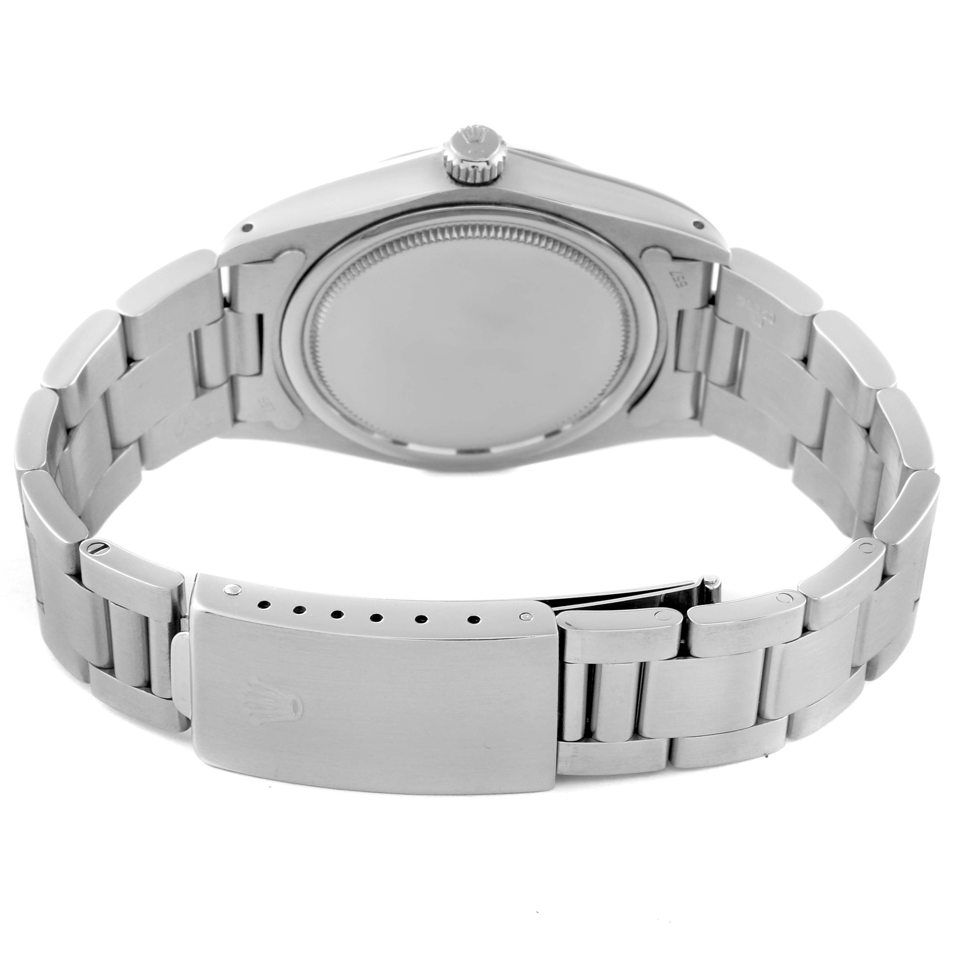 This image shows the back view of a Rolex Vintage Collection 6694 Men's Stainless Steel Silver Dial 6694 Men's Stainless Steel Silver Dial watch, displaying the closed case back and the metal bracelet with the clasp.