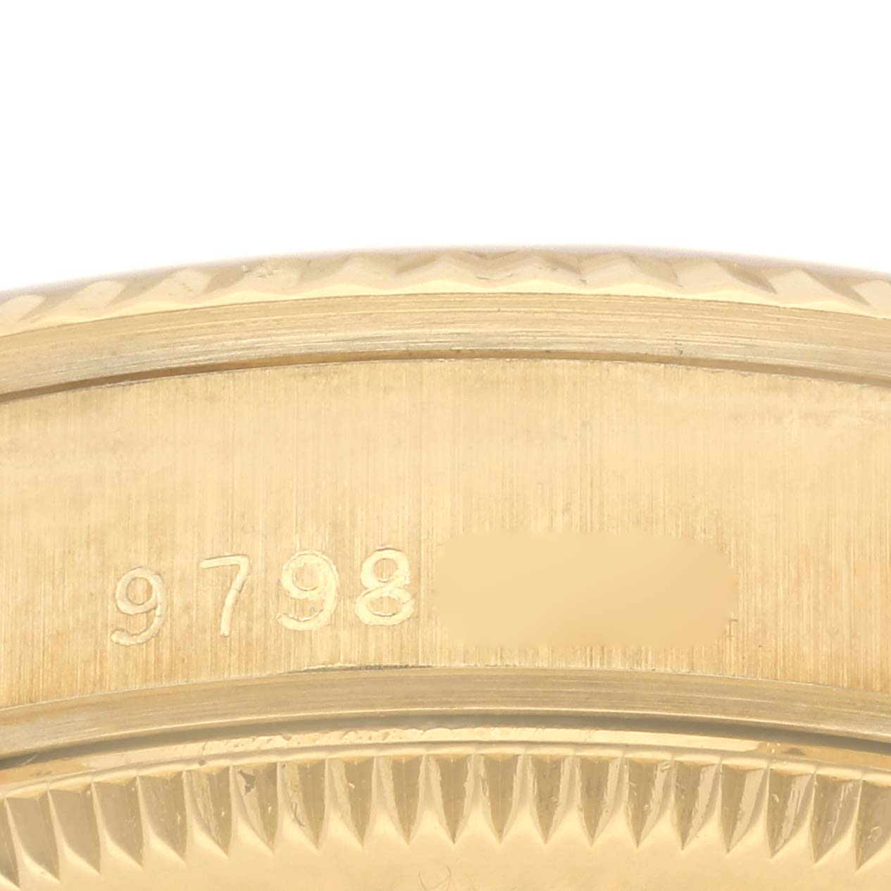 This image shows a close-up of the serial number engraved on the case of a Rolex President 68278 Women's Yellow Gold White Dial 68278 Women's Yellow Gold White Dial model watch.