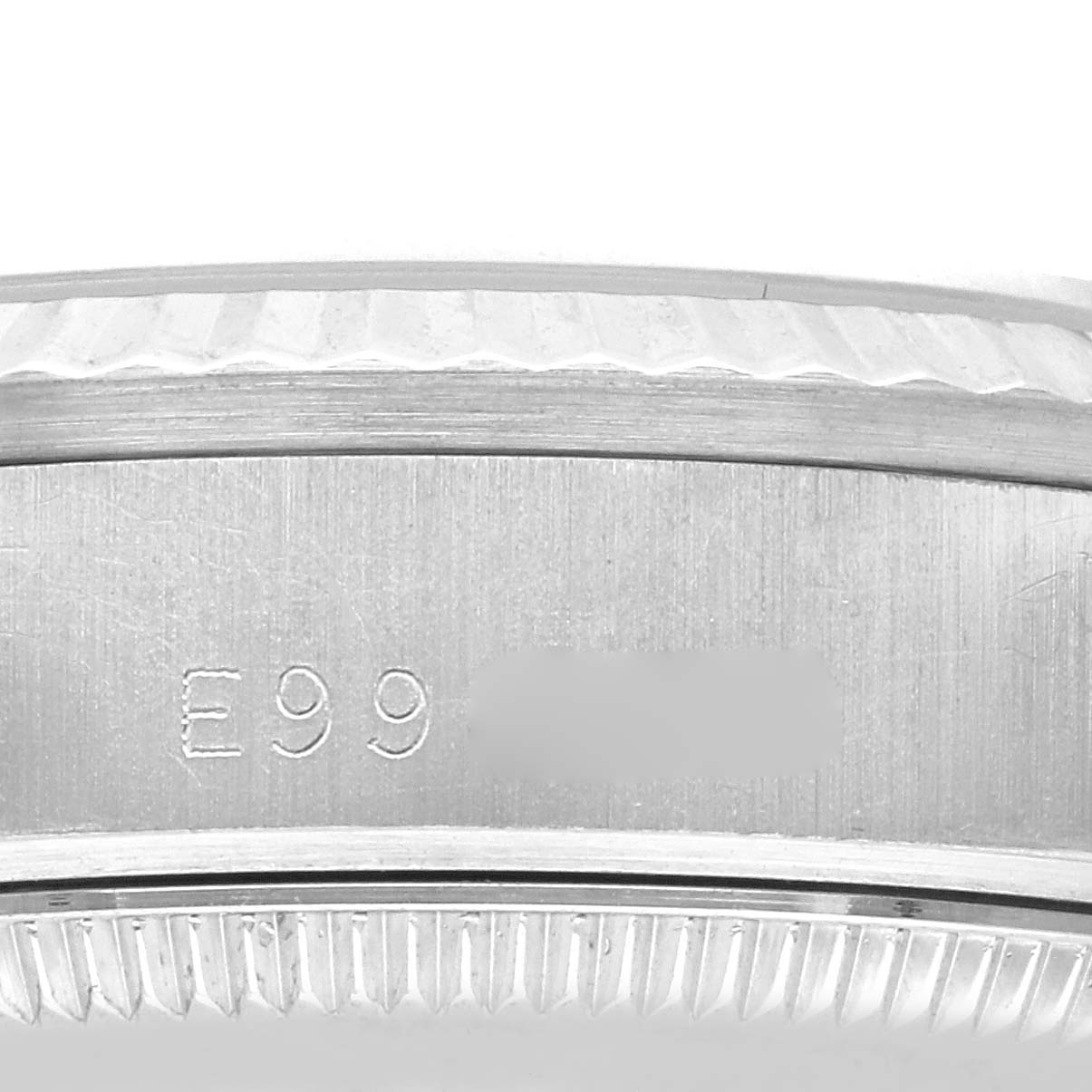 This close-up image shows part of the bezel and caseback edge of a Rolex President 68279 Women's White Gold Black Dial 68279 Women's White Gold Black Dial model watch, with serial numbers visible.