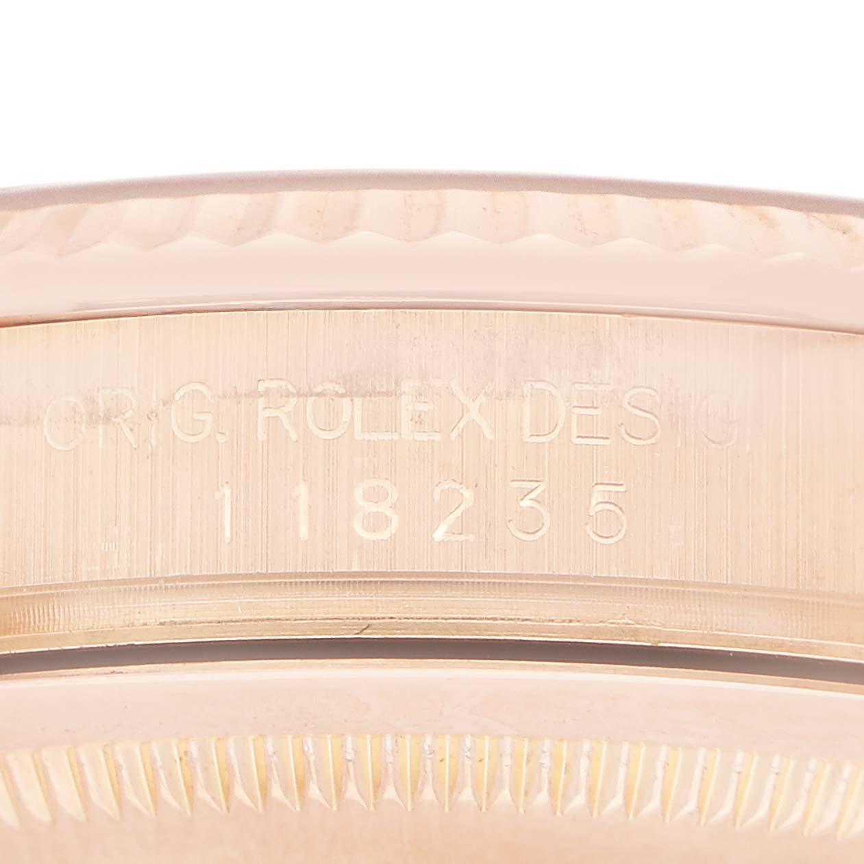 The image shows the side view of a Rolex President 118235 Men's Rose Gold Pink Dial watch case, displaying the engraved model number.