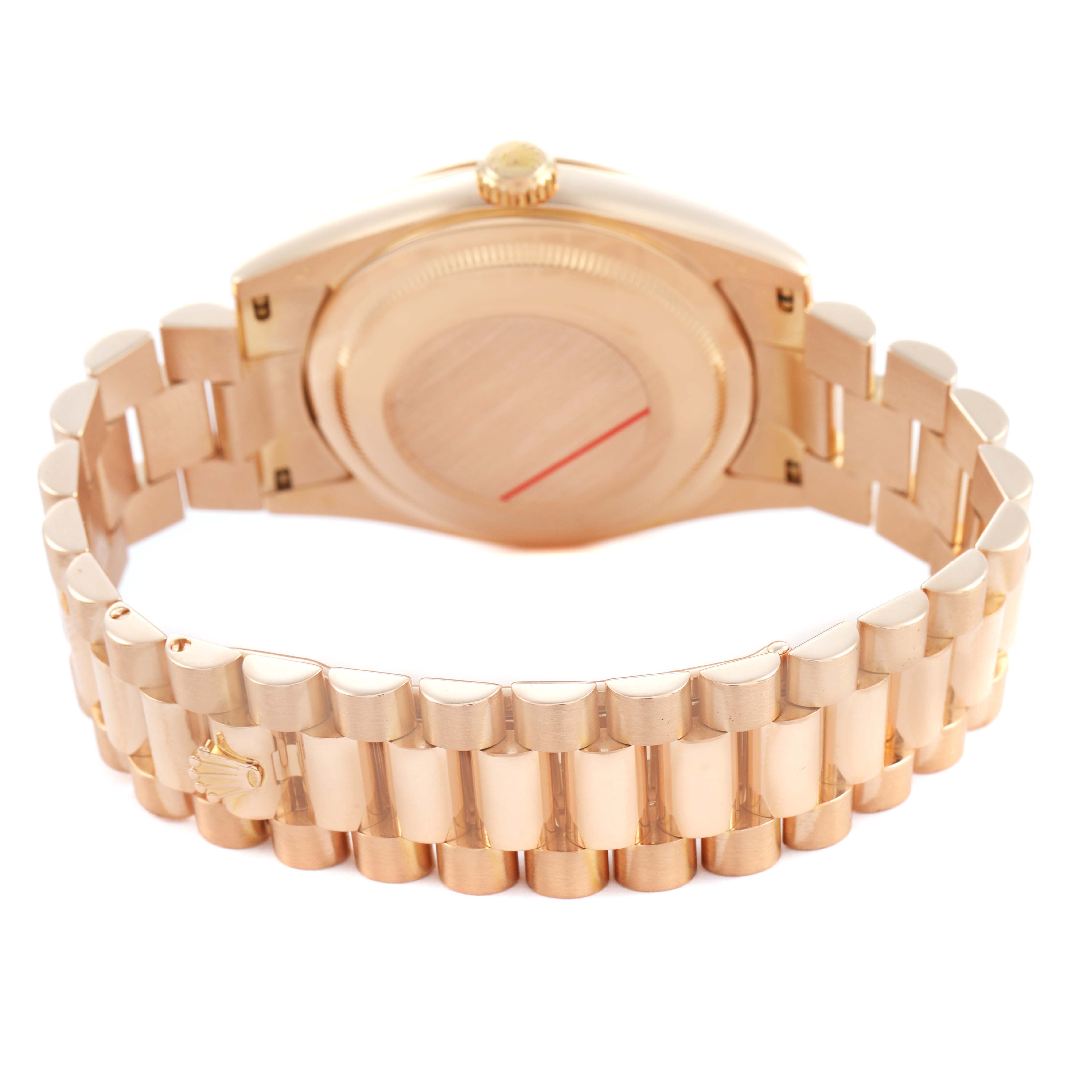 The image shows the back and bracelet of a Rolex President 118235 Men's Rose Gold Pink Dial, focusing on the case back and the gold link bracelet.