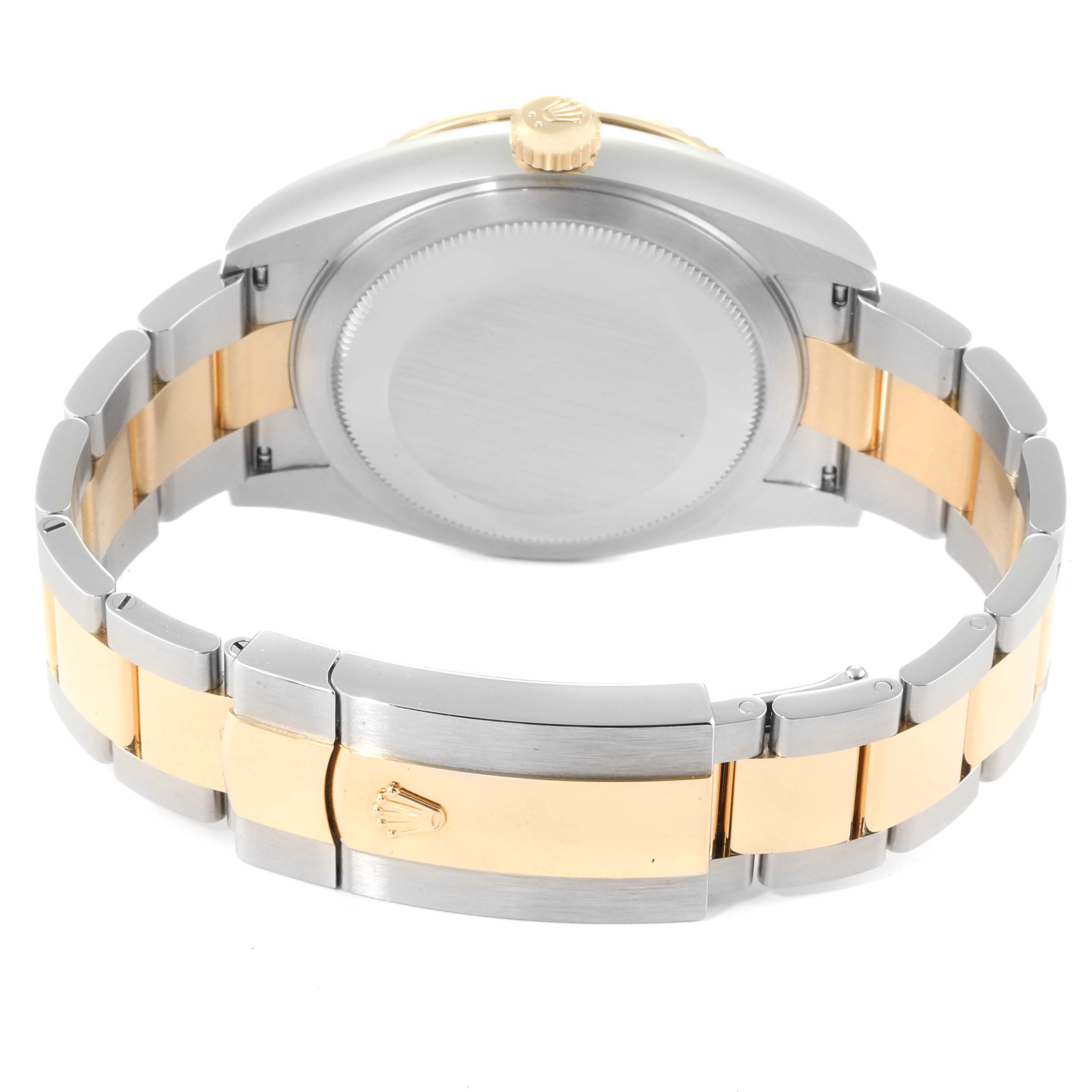 The image shows the backside and clasp of a Rolex Sky-Dweller 326933 Men's Steel and Gold (two tone) Black Dial 326933 Men's Steel and Gold (two tone) Black Dial watch, emphasizing its two-tone bracelet and case back.