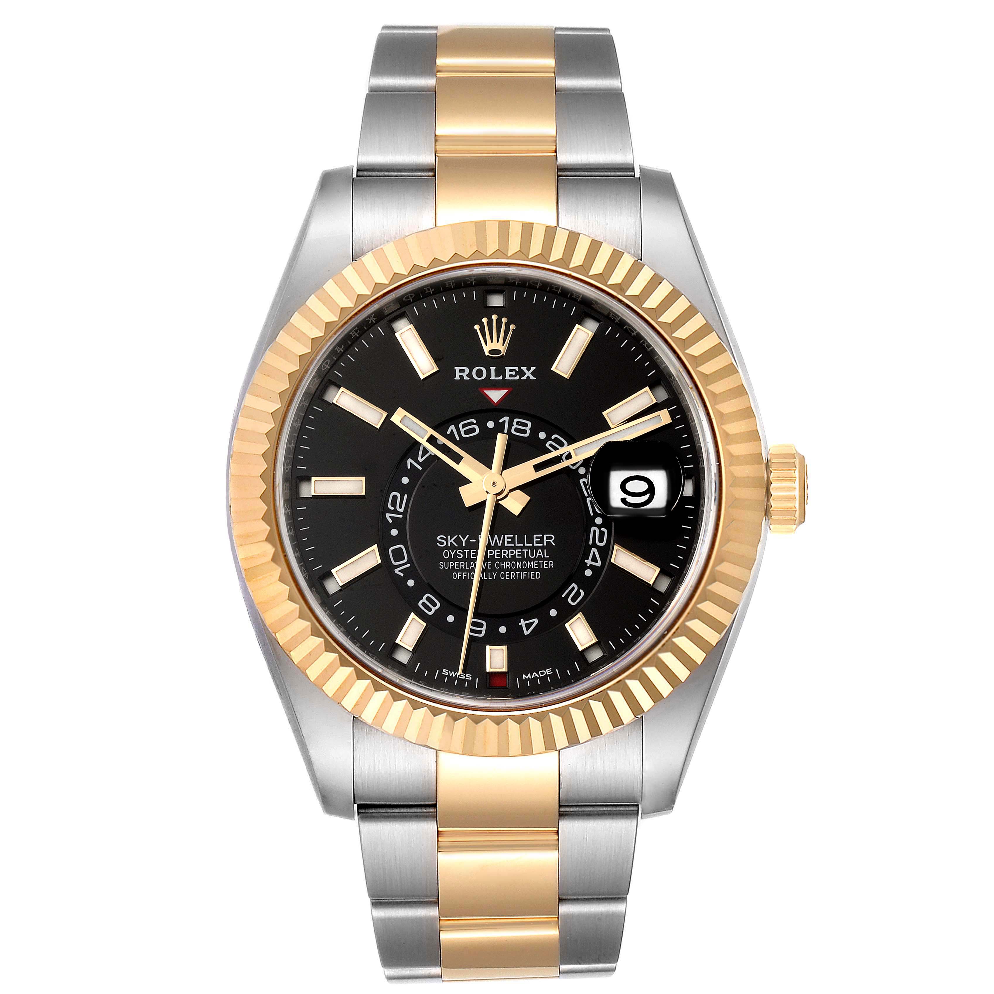 The image shows the front view of a Rolex Sky-Dweller 326933 Men's Steel and Gold (two tone) Black Dial 326933 Men's Steel and Gold (two tone) Black Dial watch, featuring a black dial, gold bezel, and a two-tone metal bracelet.