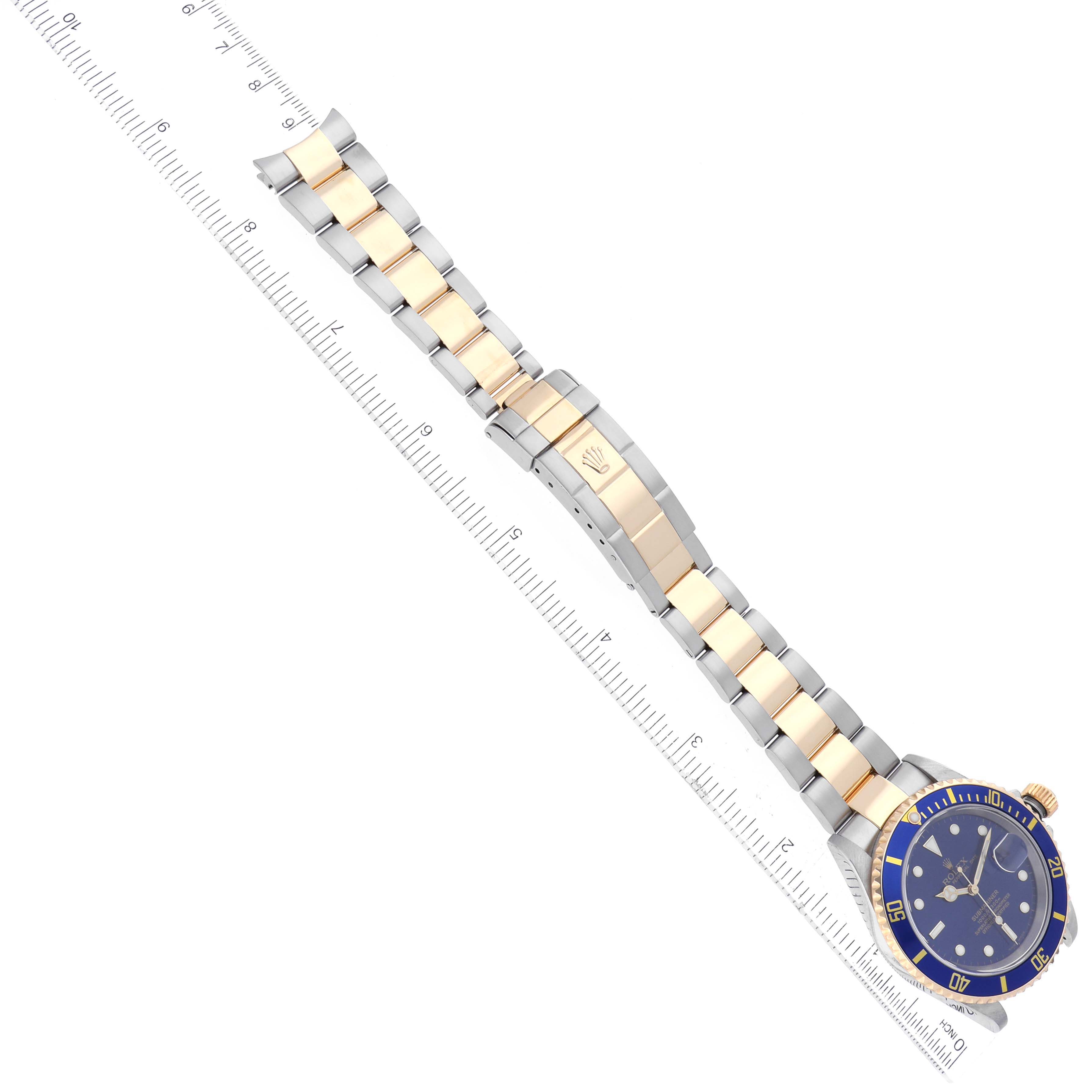 The Rolex Submariner 16613 Men's Steel and Gold (two tone) Blue Dial 16613 Men's Steel and Gold (two tone) Blue Dial watch is shown at a top-down angle, displaying its two-tone bracelet and blue dial.