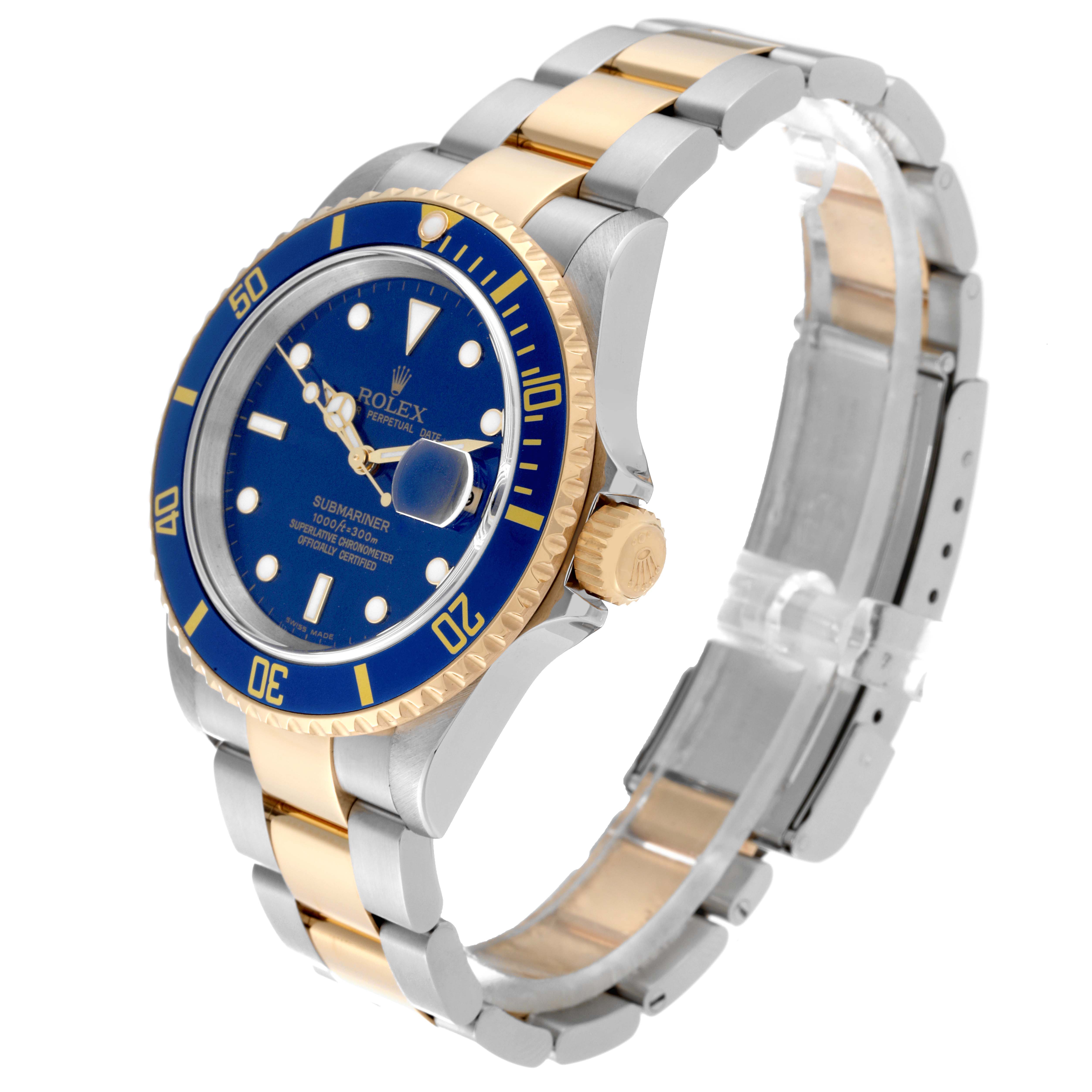 This Rolex Submariner 16613 Men's Steel and Gold (two tone) Blue Dial 16613 Men's Steel and Gold (two tone) Blue Dial watch is shown at a three-quarter angle, highlighting its blue dial, gold bezel, and silver-gold bracelet.