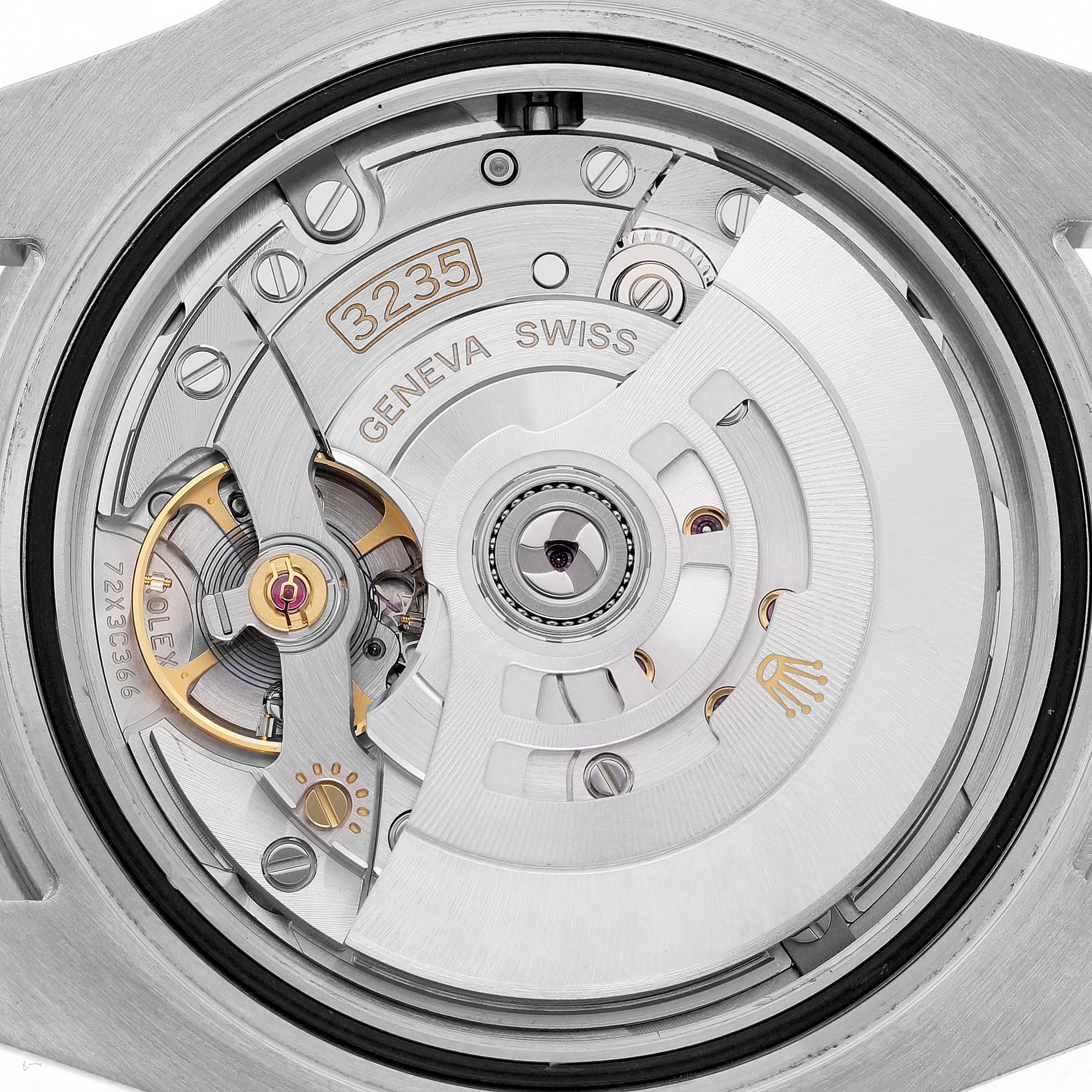 The image shows the movement of the Rolex Submariner 126610LN Men's Stainless Steel Black Dial watch from a top-down angle, highlighting the intricate rotor and gears.