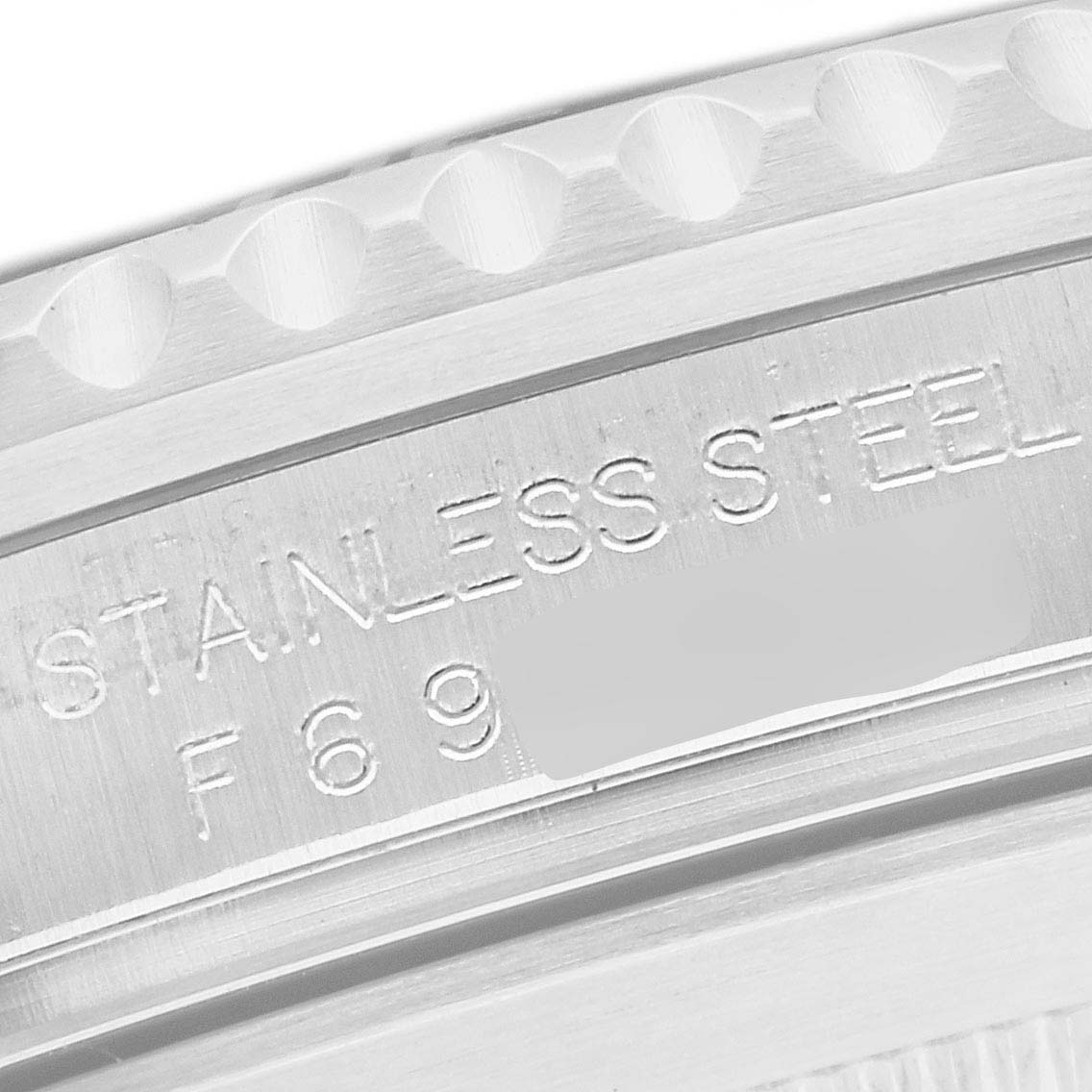 This image shows a close-up view of the side of the watch case, displaying the serial engraving on the Rolex Submariner 16610 Men's Stainless Steel Black Dial 16610 Men's Stainless Steel Black Dial.