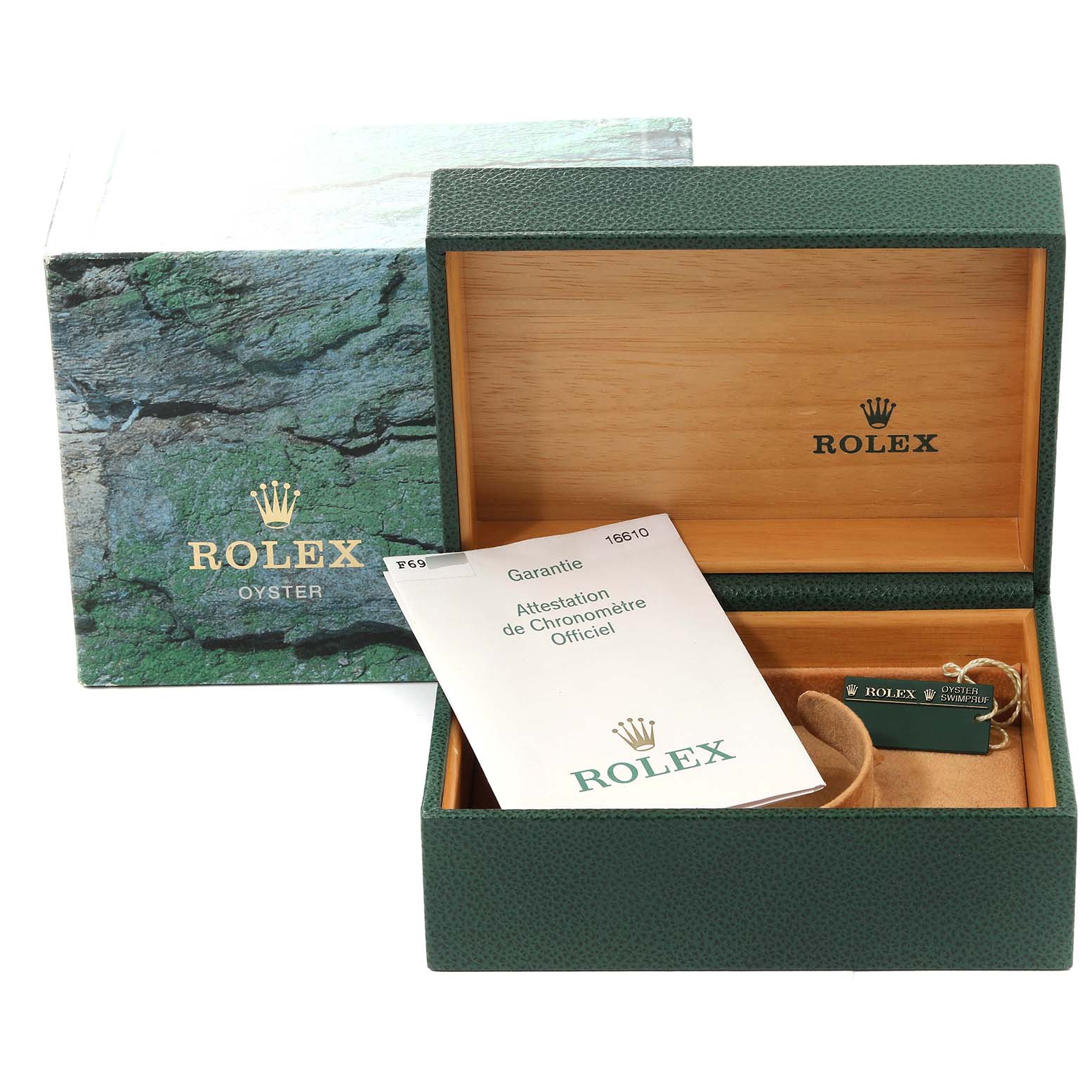 This image shows the packaging for a Rolex Submariner 16610 Men's Stainless Steel Black Dial 16610 Men's Stainless Steel Black Dial, including the outer box, inner box, warranty papers, and tags.