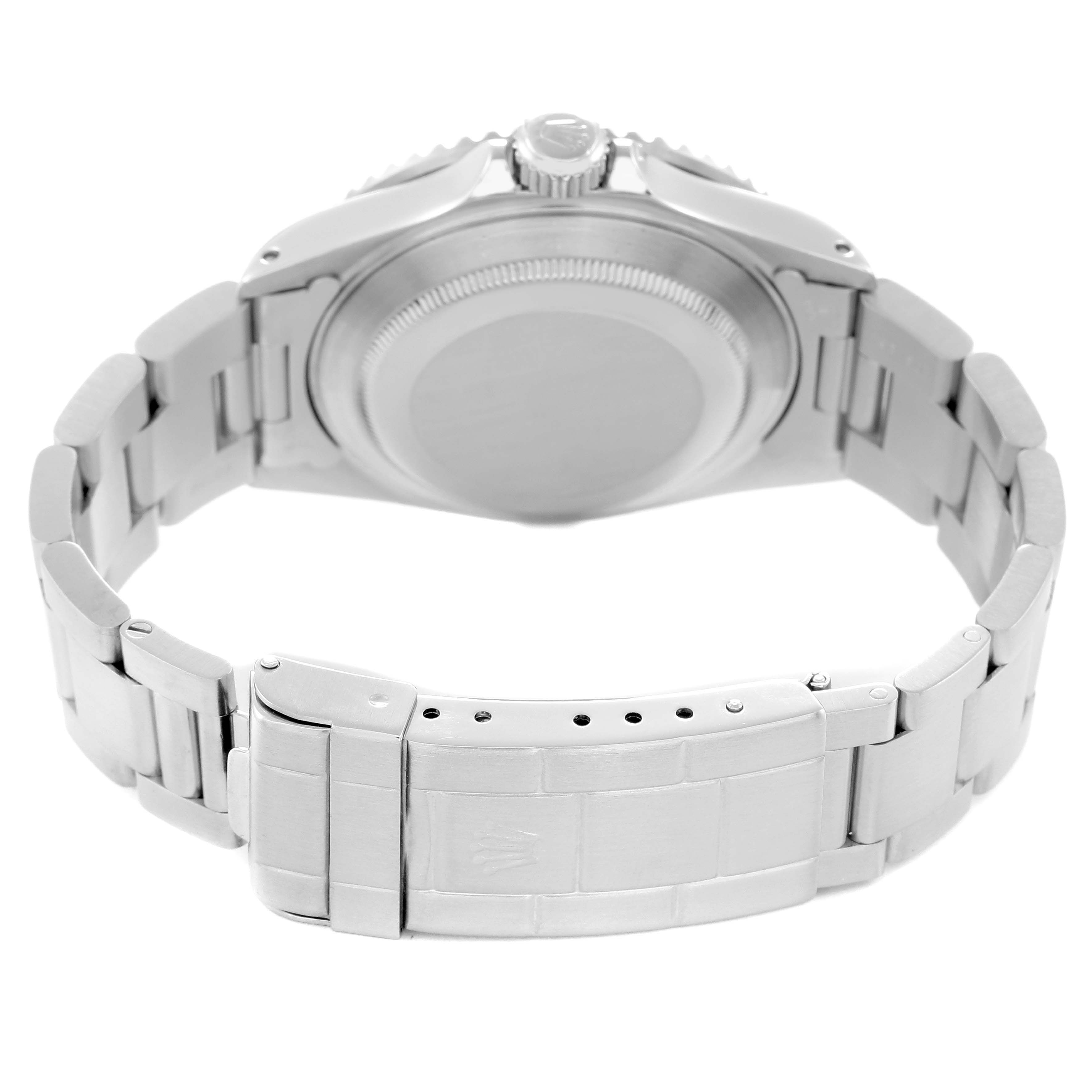 The image shows the back view of a Rolex Submariner model 16610, highlighting the case back, bracelet, and clasp.