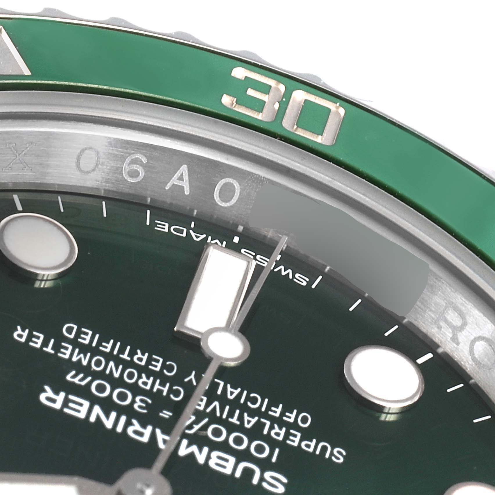 Close-up of the Rolex Submariner 116610LV Men's Stainless Steel Green Dial 116610LV Men's Stainless Steel Green Dial's dial and bezel at an angle, highlighting the green 30-minute mark and text details.