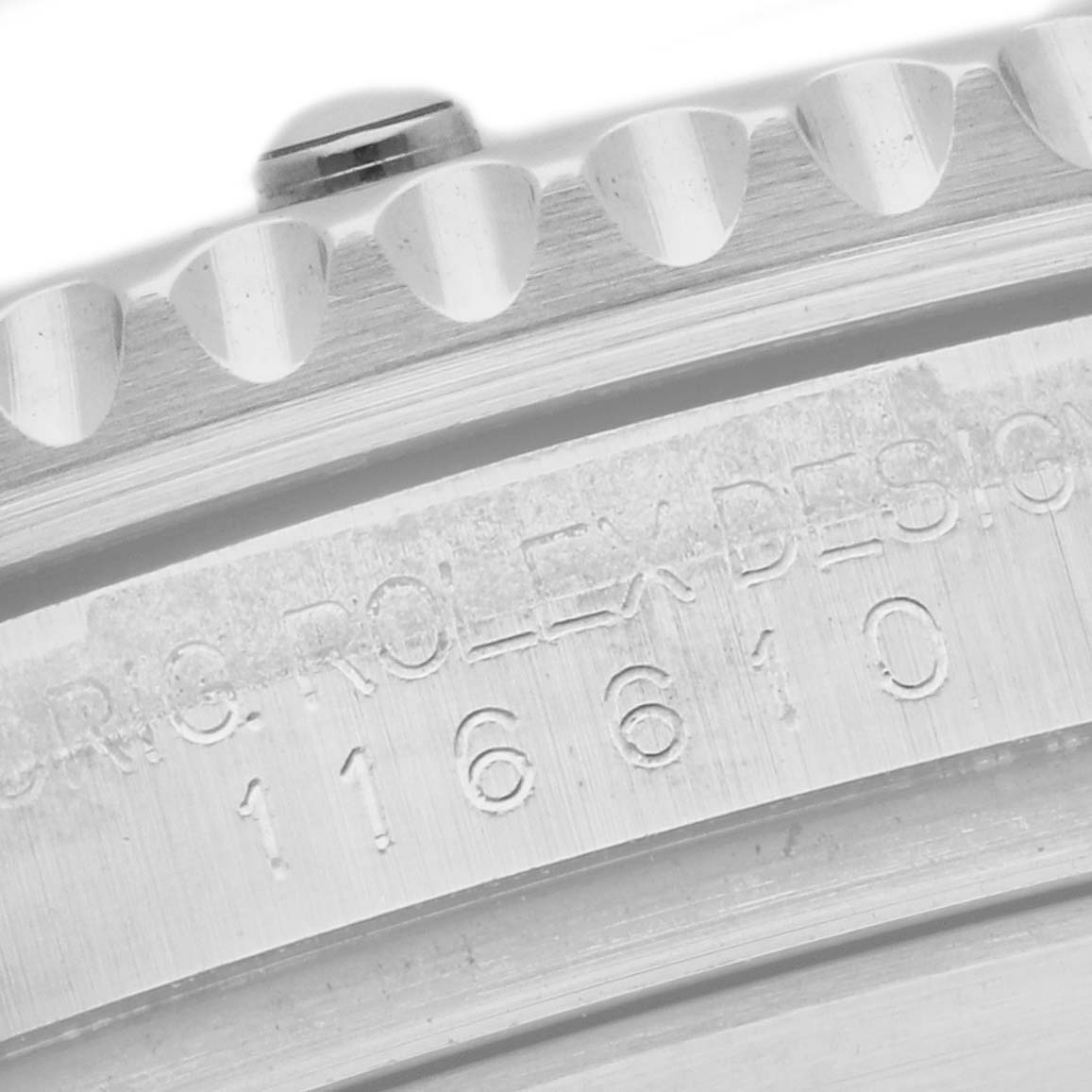 The image shows a close-up of the engraved case side and bezel of a Rolex Submariner 116610LV Men
s Stainless Steel Green Dial 116610LV Men
s Stainless Steel Green Dial watch.