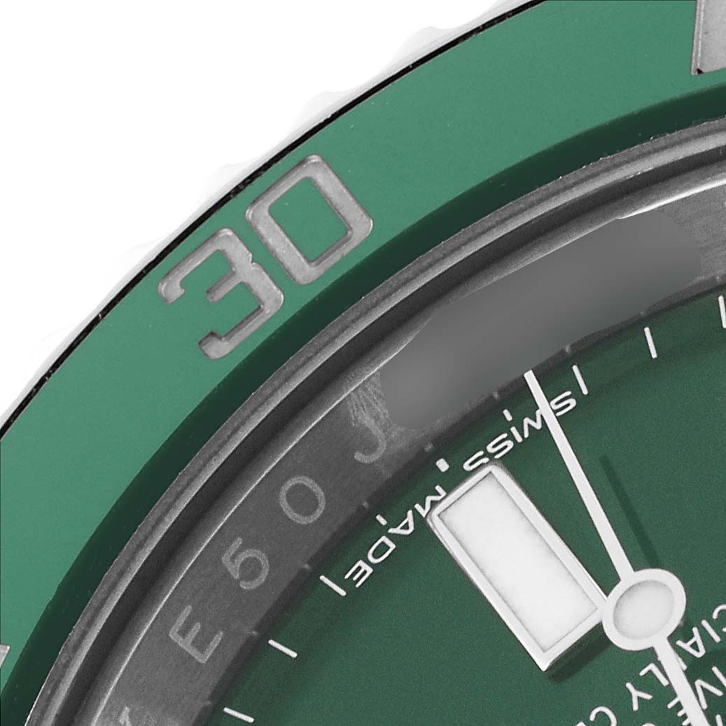 This close-up image shows the green bezel and part of the dial of a Rolex Submariner 116610LV Men
s Stainless Steel Green Dial 116610LV Men
s Stainless Steel Green Dial watch.