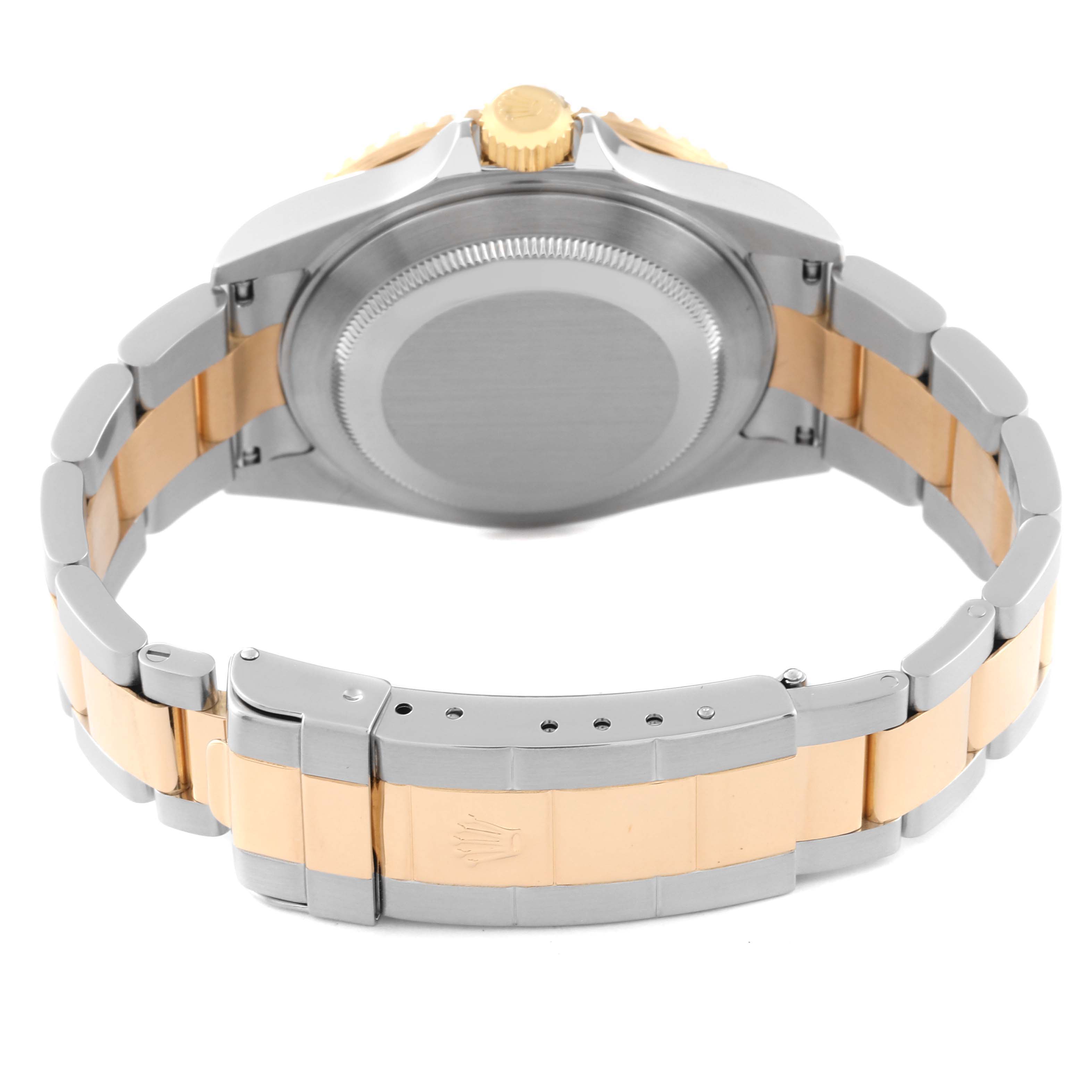 The image shows the back case, crown, and bracelet of a Rolex Submariner 16613 Men's Steel and Gold (two tone) Black Dial 16613 Men's Steel and Gold (two tone) Black Dial watch from a low rear angle.