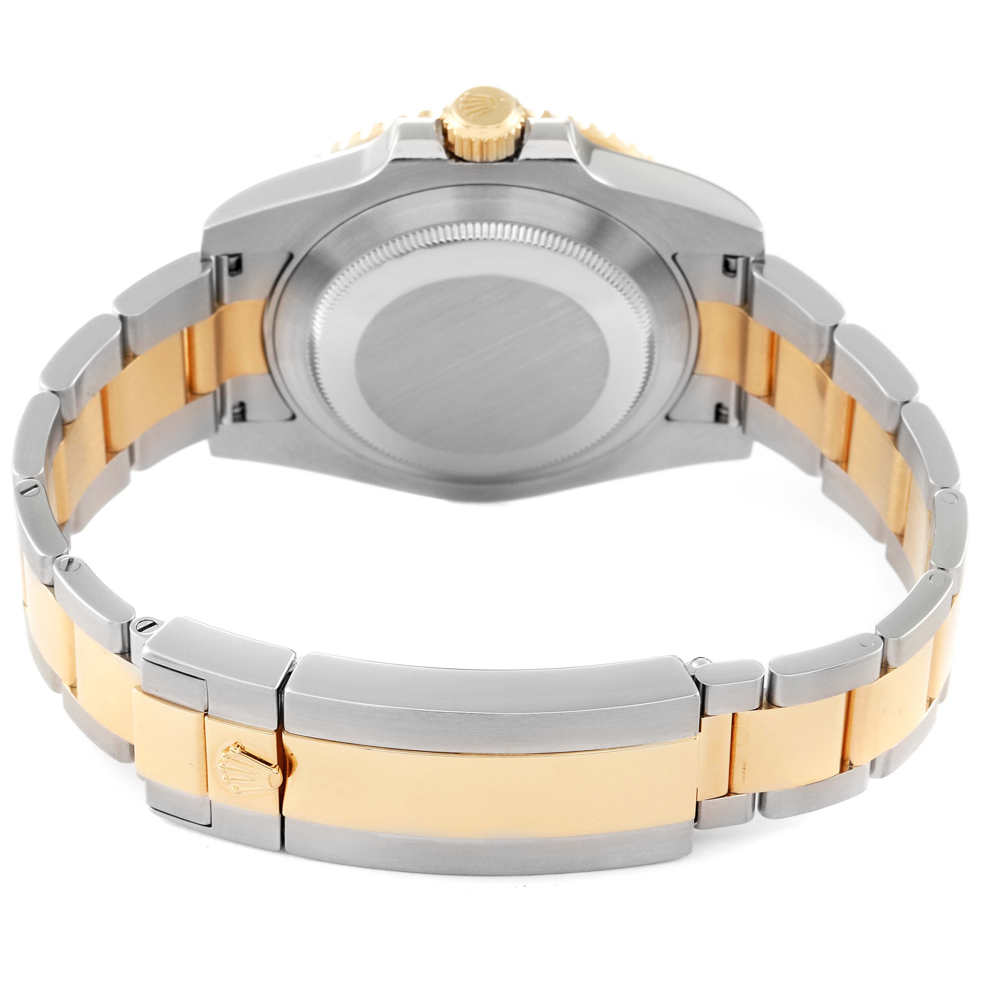 The image shows the case back and bracelet of a Rolex Submariner 116613 Men
s Steel and Gold (two tone) Blue Dial 116613 Men
s Steel and Gold (two tone) Blue Dial watch, viewed from the rear.