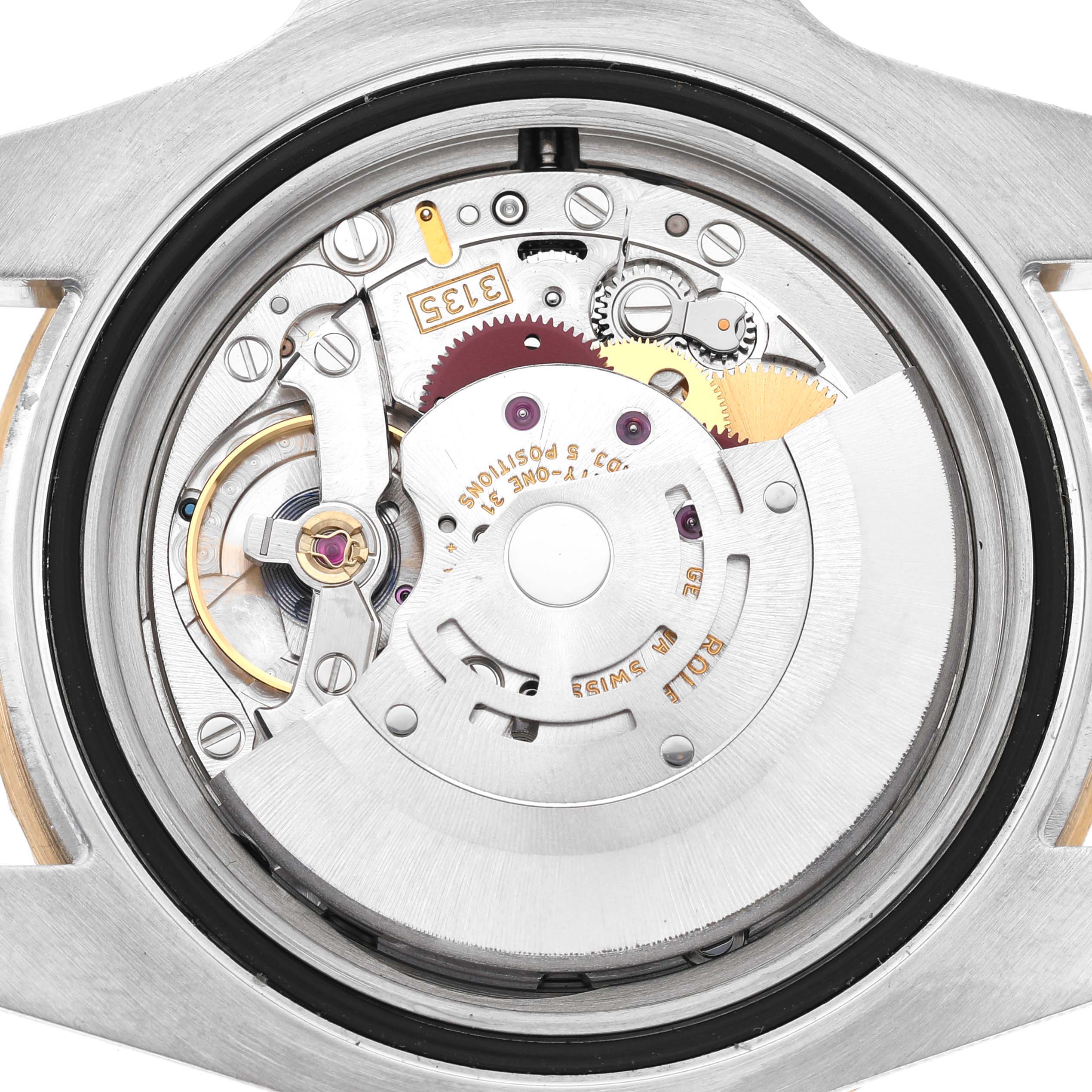 The image shows the movement mechanism of a Rolex Submariner 116613 Men's Steel and Gold (two tone) Black Dial, viewed from the back.