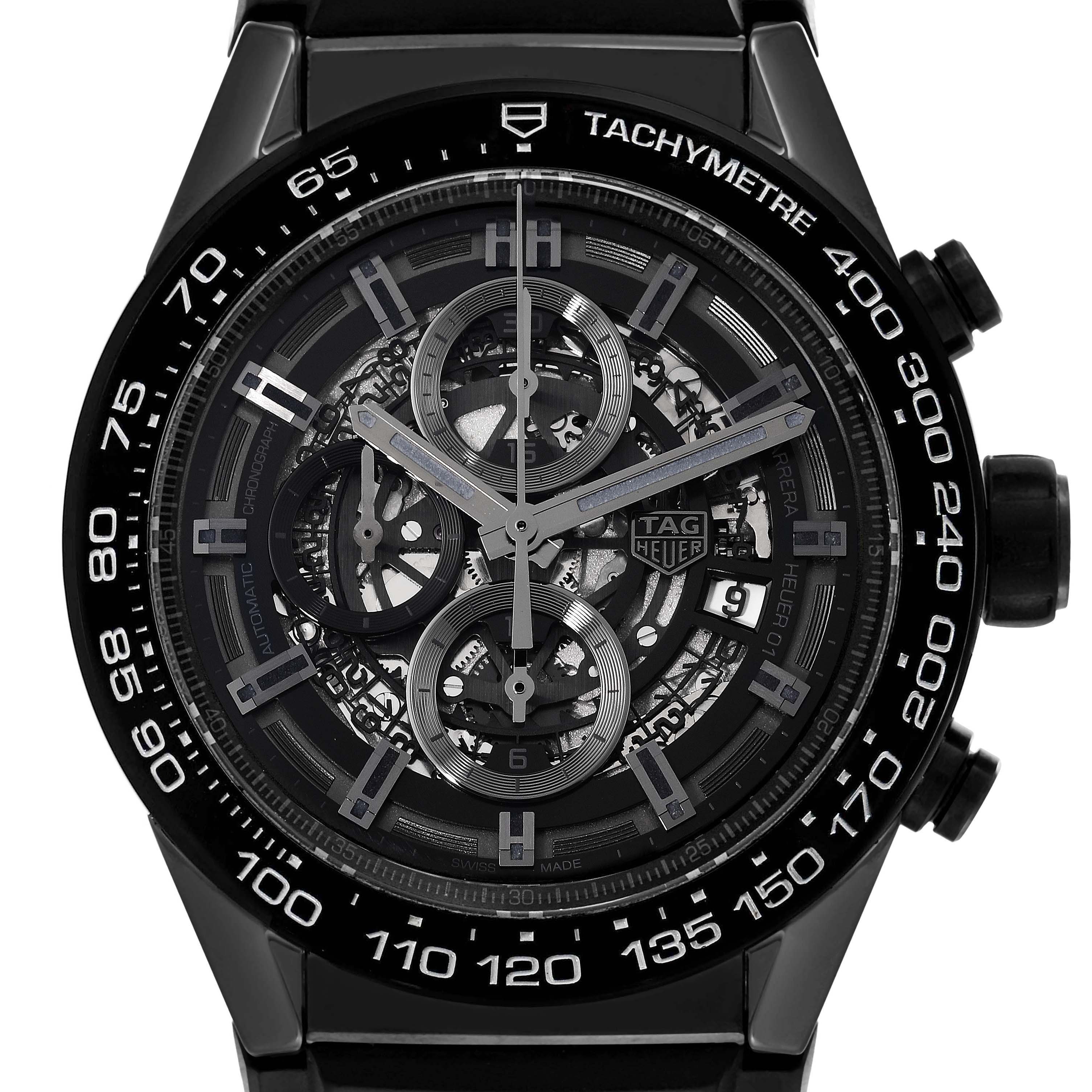 The image shows a Tag Heuer Carrera CAR2A90.FT6071 Men's Ceramic Black Dial CAR2A90.FT6071 Men's Ceramic Black Dial watch face with detailed gears and a tachymeter scale.